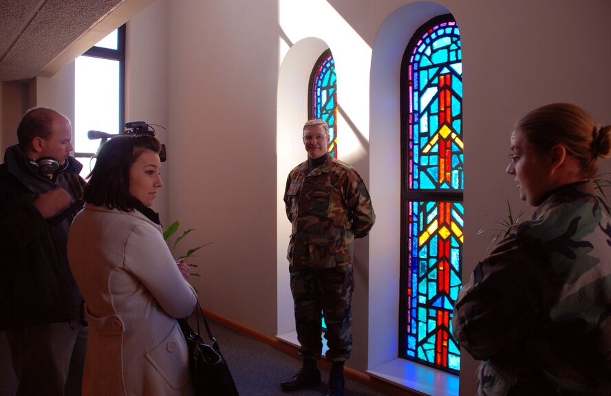 The 932nd Airlift Wing's chapel staff, including Master Sgt. Harold Von De Bur and Senior Airman Heather Johnson, welcomed three broadcasters from the University of Illinois during a recent tour.