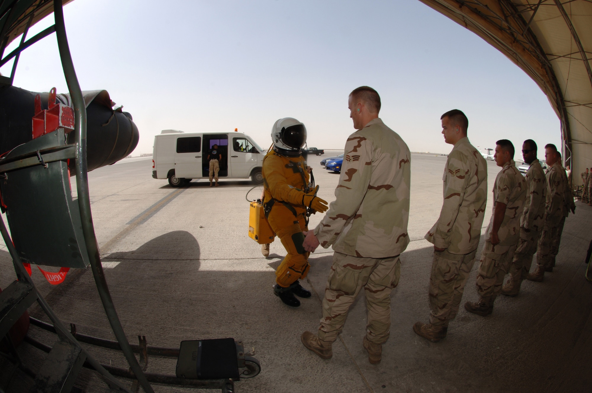 Capt. Ross Franquemont, a U-2 Dragon Lady pilot from the 99th Expeditionary Reconnaissance Squadron at an air base in Southwest Asia, shakes the hands of the crew chiefs Mar. 5 who have prepared his jet for a reconnaissance mission. The 380th Air Expeditionary Wing hosts the only U-2 squadron in the area of responsibility, providing high-altitude intelligence, surveillance and reconnaissance for support in winning the war on terror.  (U.S. Air Force photo/Senior Airman Levi Riendeau)