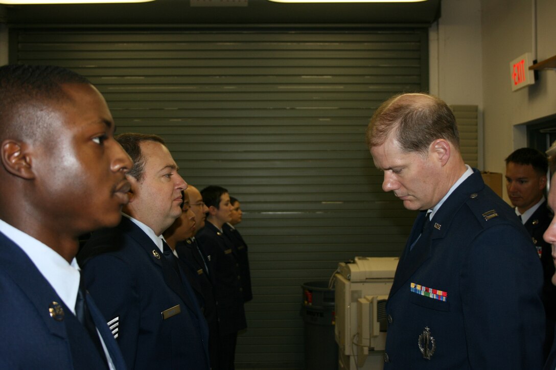 SEYMOUR JOHNSON AIR FORCE BASE, N.C. -- Capt. Marvin Boswell (right), communications and operations officer, conducts an open-ranks service dress inspection during the March unit training assembly. The inspection was conducted with reservists from the 916th Communication Squadron. U.S. Air Force photo/Master Sgt. Shane Lynch