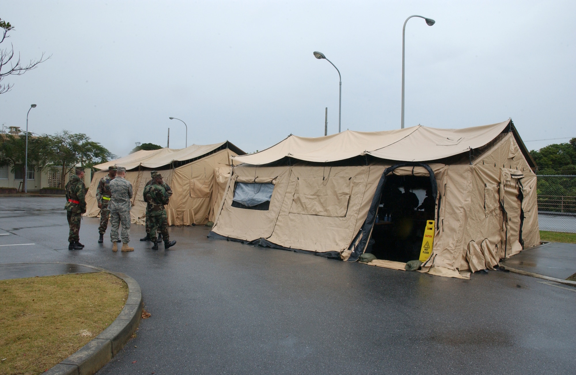 The 18th Services Squadron offers a variety of food from their single pallet expeditionary kitchen during the 2008 Pacific Air Forces Operational Readiness Inspection at Kadena Air Base, Japan, March 11, 2008. The deployable kitchen can be set up from pallet to serving in under four hours. PACAF is conducting the inspection from March 9 to 15 to validate the mission readiness of the 18th Wing. (U.S. Air Force photo/Senior Airman Jeremy McGuffin) 