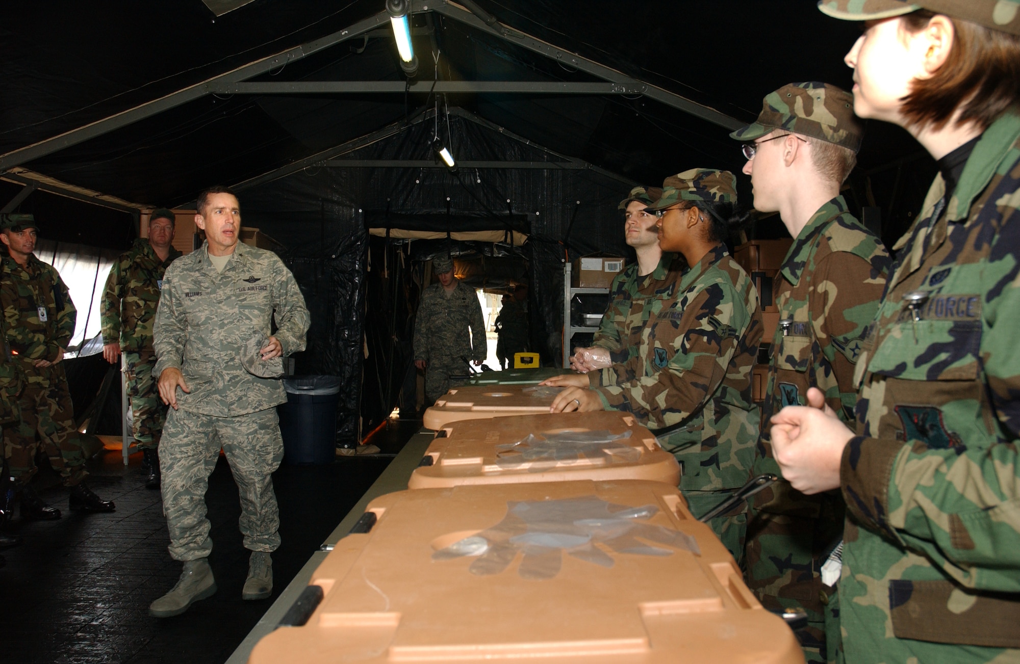 Brig. Gen. Brett Williams, 18th Wing commander, thanks the Airmen of the 18th Services Squadron's single pallet expeditionary kitchen for a great meal and for doing a good job setting the tents up during the 2008 Pacific Air Forces Operational Readiness Inspection at Kadena Air Base, Japan, March 11, 2008. The deployable kitchen can be set up from pallet to serving in under four hours. PACAF is conducting the inspection from March 9 to 15 to validate the mission readiness of the 18th Wing.  (U.S. Air Force photo/Senior Airman Jeremy McGuffin)