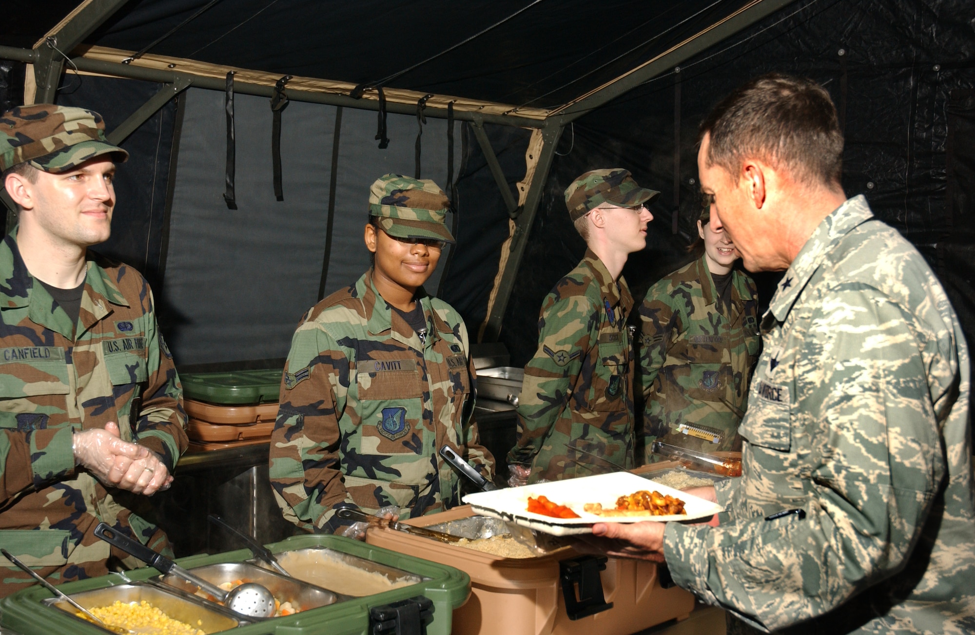 Brig. Gen. Brett Williams, 18th Wing commander, chooses from a variety of food offered by the 18th Services Squadron's single pallet expeditionary kitchen during the 2008 Pacific Air Forces Operational Readiness Inspection at Kadena Air Base, Japan, March 11, 2008. The deployable kitchen can be set up from pallet to serving in under four hours. PACAF is conducting the inspection from March 9 to 15 to validate the mission readiness of the 18th Wing. (U.S. Air Force photo/Senior Airman Jeremy McGuffin)