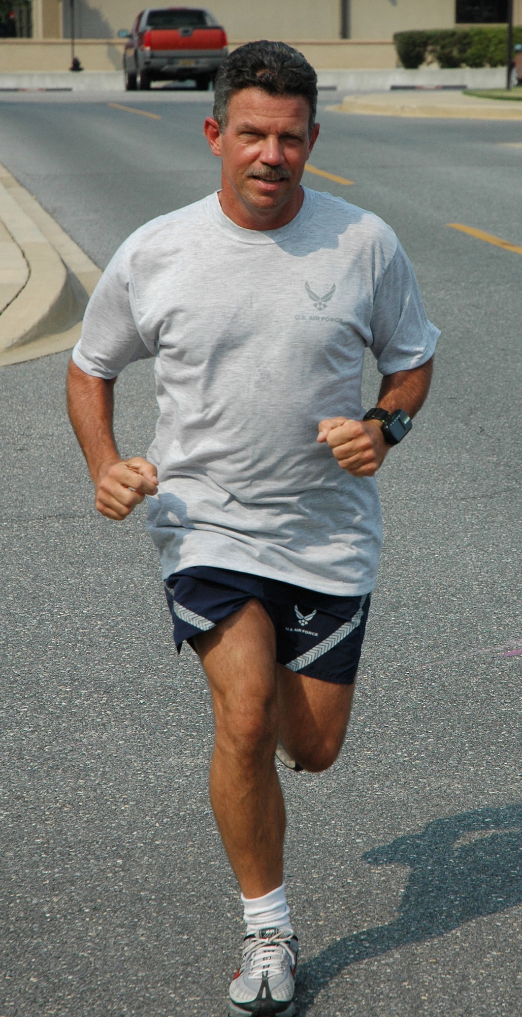 Master Sgt. Mitchell Coffey, a 709th Airlift Squadron flight engineer, is recruiting fellow Airmen to run with him in the 33rd Marine Corp Marathon Oct. 26 in Washington D.C. He's raising funds for The Fisher House Foundation, a non-profit organization and Combined Federal Campaign charity. The organization assists military members and their family members who are experiencing a medical crisis. (U.S. Air Force photo/Capt. Marnee A.C. Losurdo) 
