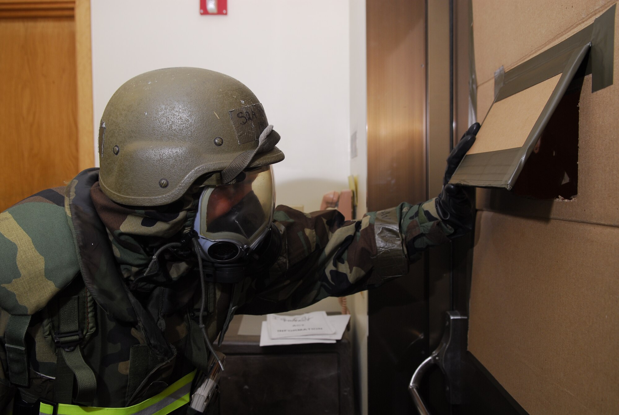 Senior Airman Derek Haste, 18th Communications Squadron, ensures all is safe outside prior to releasing sweep teams during the 2008 Pacific Air Forces Operational Readiness Inspection at Kadena Air Base, Japan, March 13, 2008. PACAF conducted the inspection from March 9 to 15 to validate mission readiness of the 18th Wing. (U.S. Air Force photo/Staff Sgt. Joshua J. Garcia)
