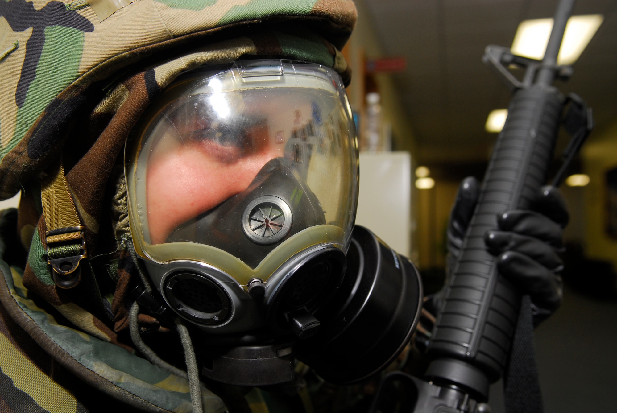 Airman 1st Class Nick Vinoverski, 18th Communications Squadron, stands guard while in mission oriented protective posture gear during the 2008 Pacific Air Forces Operational Readiness Inspection at Kadena Air Base, Japan, March 13, 2008. PACAF conducted the inspection from March 9 to 15 to validate mission readiness of the 18th Wing. (U.S. Air Force photo/Staff Sgt. Joshua J. Garcia) 
