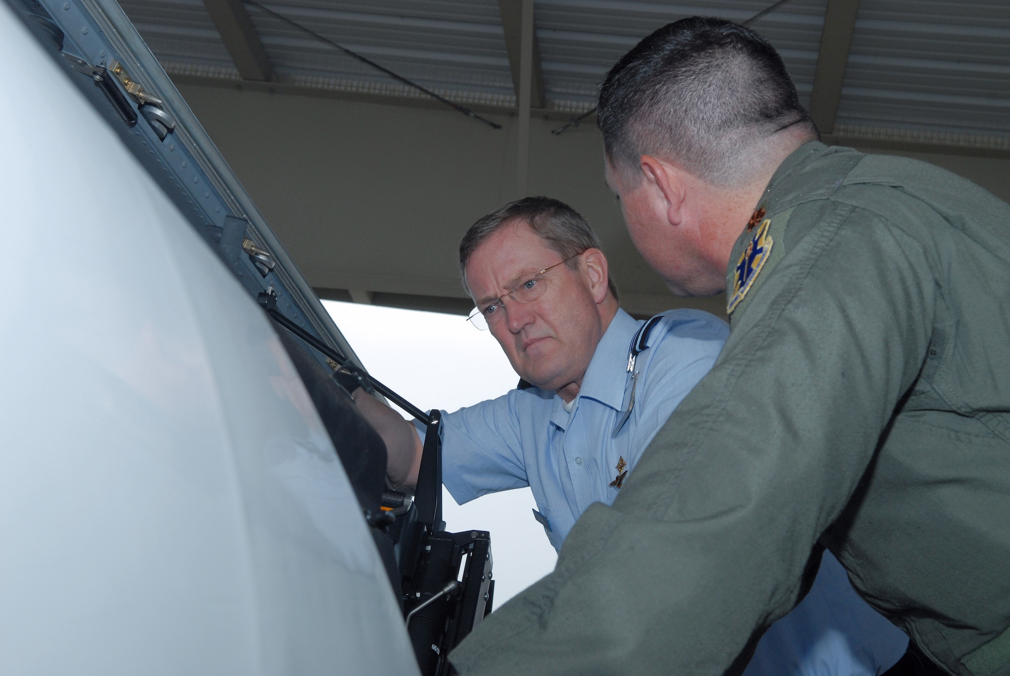 Maj. Jarrett Edge shows Lt. Gen. Hans de Jong the cockpit of a T-6A Texan II aircraft during the general's visit to Randolph Air Force Base, Texas, March 10. General Jong is the Royal Netherlands air force commander. Major Edge is from the 559th Flying Training Squadron at Randolph AFB. (U.S. Air Force photo/Richard McFadden)