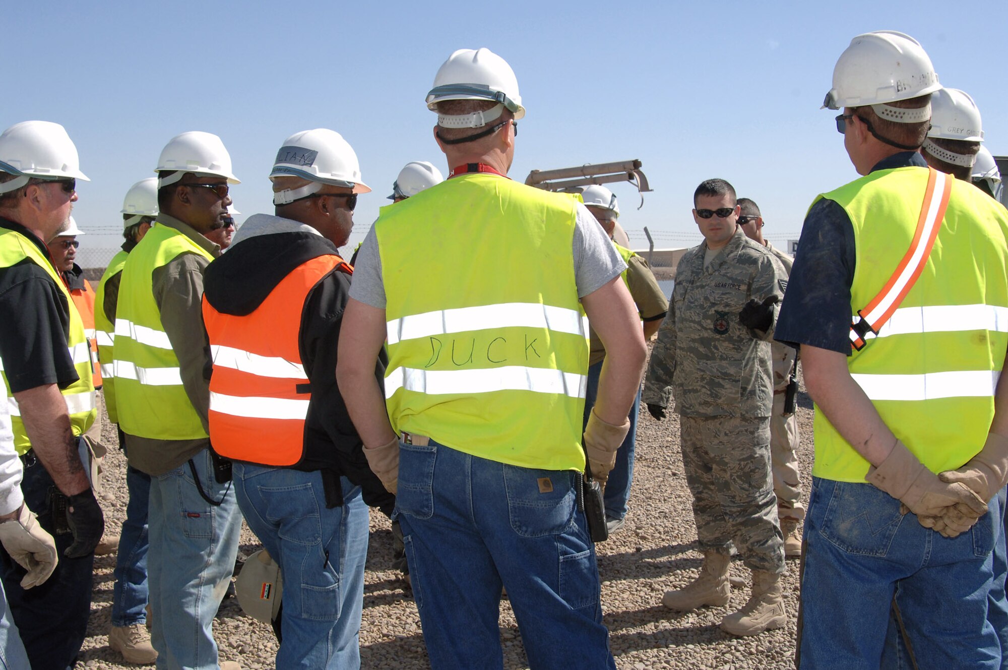 Tech. Sgt. Christopher McArdle leads a training session on using hydraulic Jaws of Life-type power tools March 5 at Balad Air Base, Iraq. The class, a first for the Balad AB fire department, marked an important step for U.S. government contractors working for KBR Theater Transportation Mission Recovery to train jointly with the Air Force. The TTM Recovery personnel are responsible for retrieving stuck, broken down and destroyed military vehicles throughout Iraq. Sergeant McArdle is a 332nd Expeditionary Civil Engineer Squadron Fire Department firefighter. (U.S. Air Force photo/Master Sgt. Heather Cabral) 
