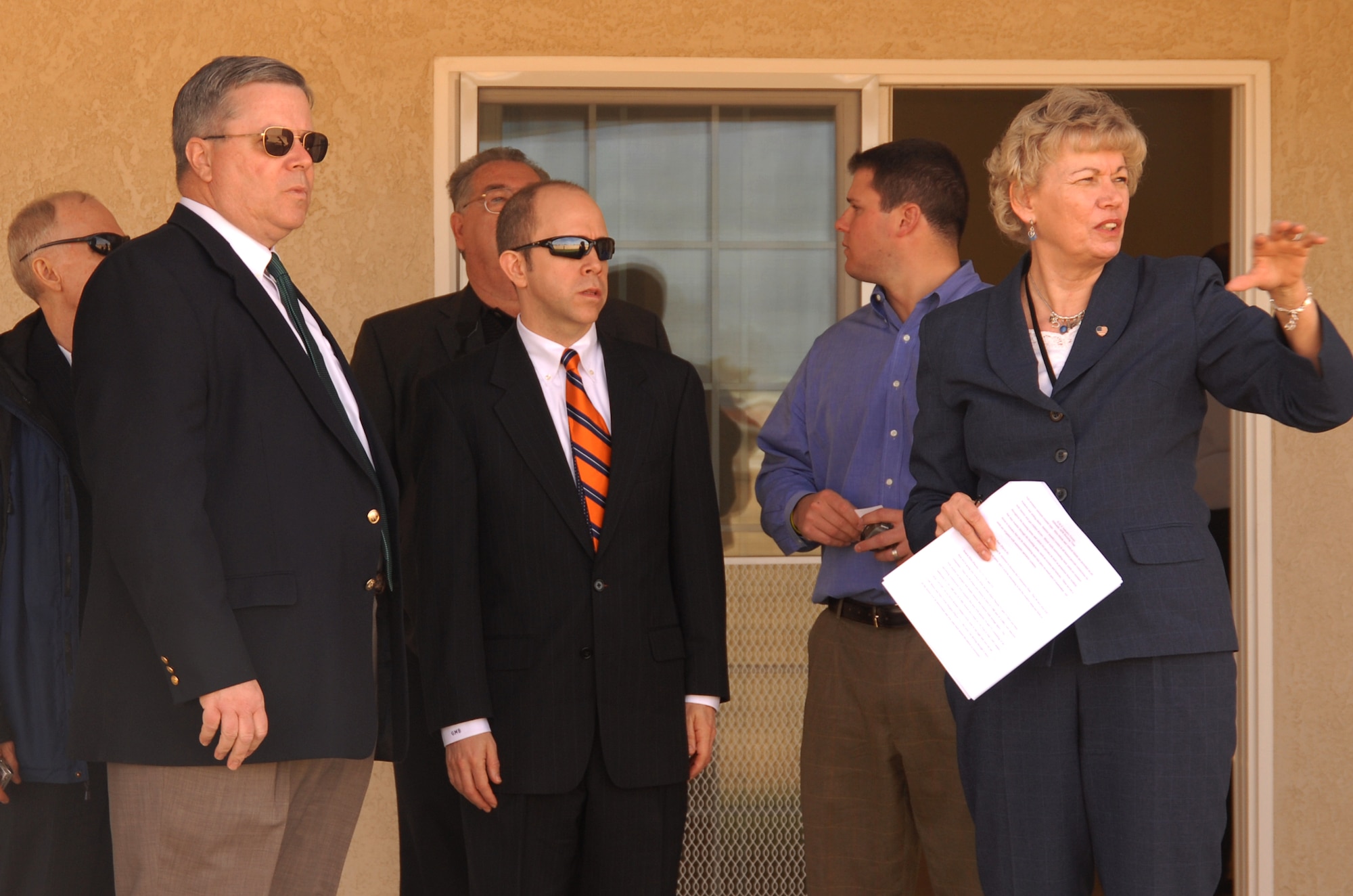 Jeanette White, 95th Air Base Wing Civil Engineer and Transportation Directorate housing coordinator, speaks to a housing developer about the housing plans at Edwards. Several potential developers were given a tour of seven homes around base. (Air Force photo by Airman 1st Class Stacy Sanchez)