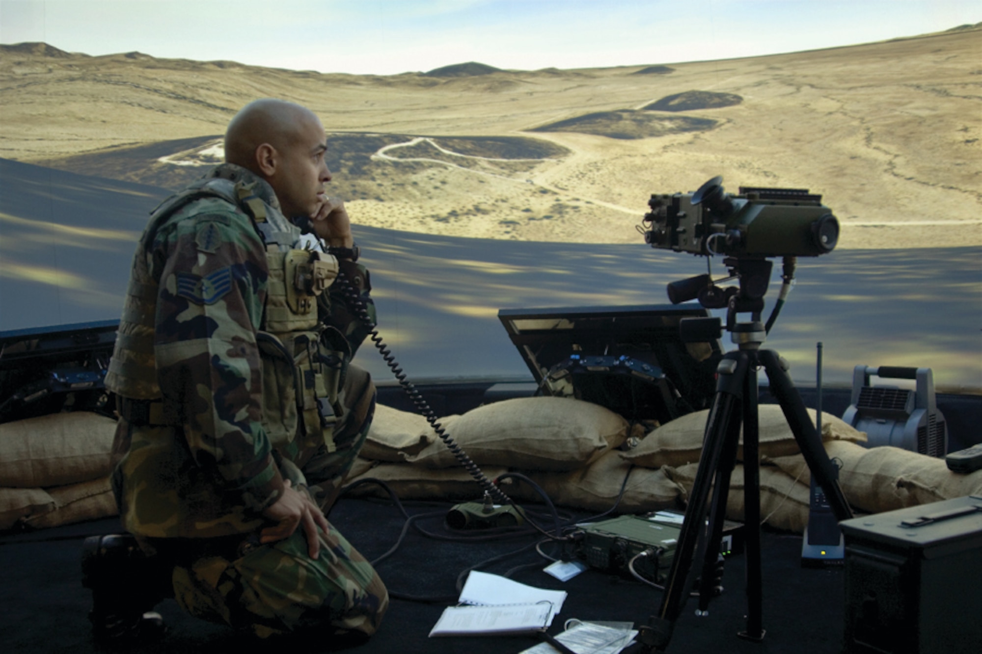 Staff Sergeant Dennis Krouse, of the 9th Air Support Operations Squadron, calls for F-16 close air support on enemy positions inside the virtual environment of AFRL’s Joint Terminal Attack Control Training and Rehearsal System (photo by AFRL’s Gina Cinardo).