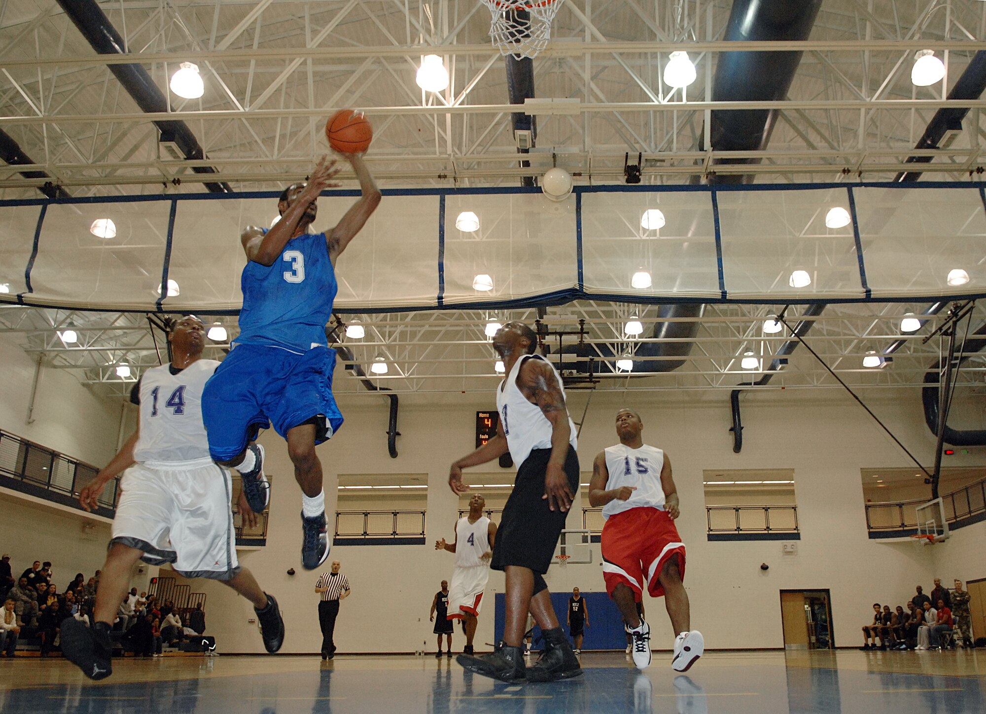 LANGLEY AIR FORCE BASE, Va. -- Anthony Mears, 1st Medical Group, attempts a layup during the Langley Intramural Basketball Under 35 Championship March 7. Mears helped lead the 1st MDG in the first half with eight points, but couldn't sustain as the 1st Security Forces Squadron surged ahead, 49-39. The 1st SFS finished the season with 20 wins and three losses. (U.S. Air Force photo/Senior Airman Vernon Young)