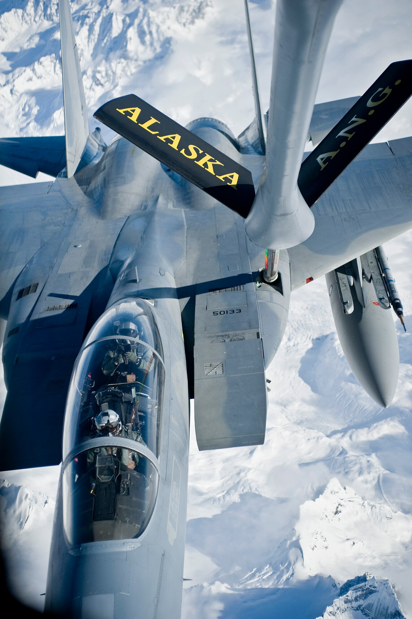 OVER ALASKA -- A KC-135 Stratotanker from the Alaska Air National Guard 168th Air Refueling Wing refuels a F-15D Eagle from the 19th Fighter Squadron at Elmendorf Air Force Base. With the KC-135's mission of air refueling, the F-15's capabilities can accomplish its mission of global engagement. (U.S. Air Force photo by Airman 1st Class Jonathan Steffen)