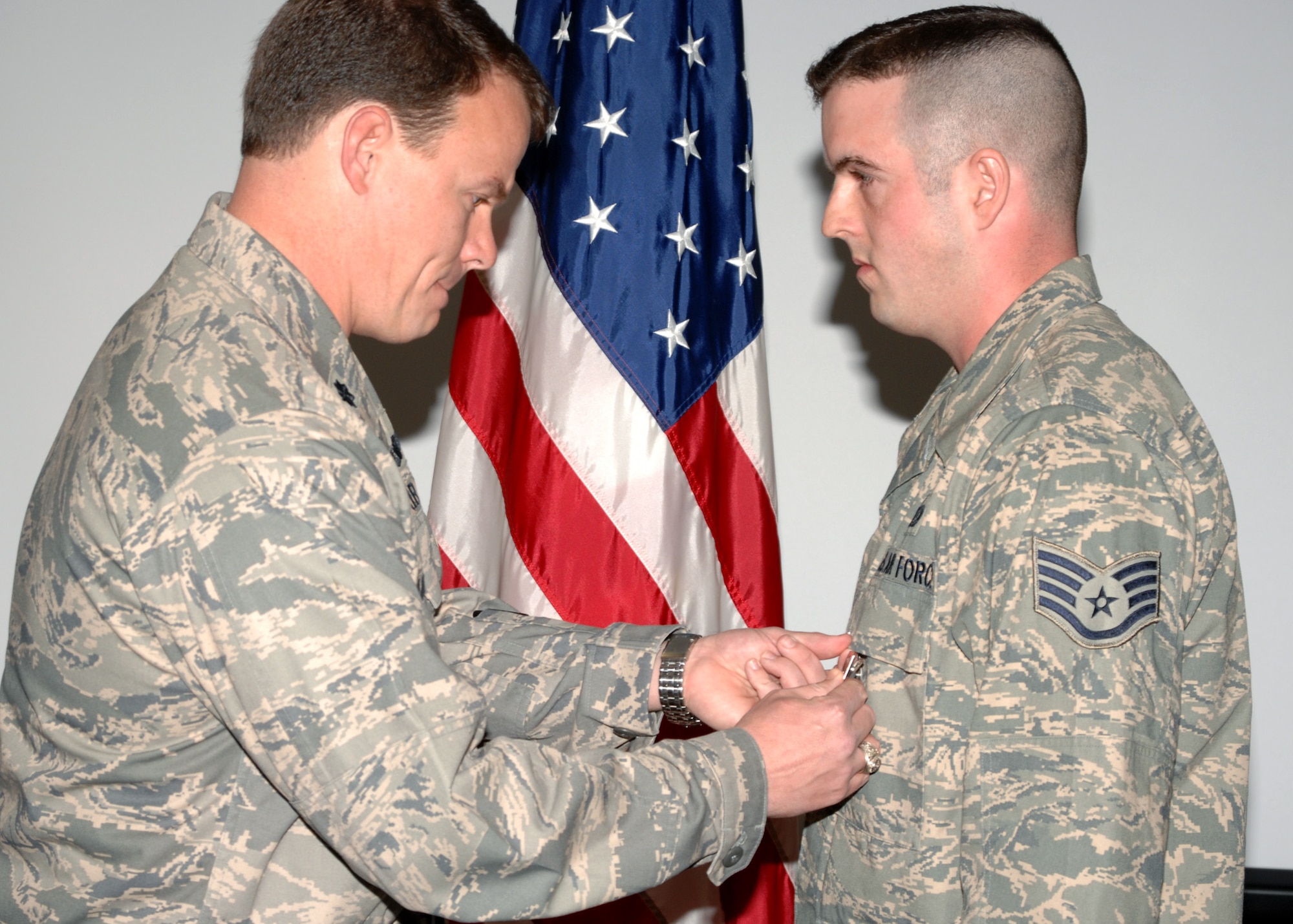 Lieutenant Colonel Byron Anderson presents Staff Sergeant Daniel Spencer with a Bronze Star and Air Force Combat Action Metal at Seymour Johnson AFB, North Carolina on March 12, 2008.  Staff Sergeant Spencer distinguished himself on a 365 day rotation to South West Asia.

(US Air Force photo by Airman First Class Salma Din)(Released)
