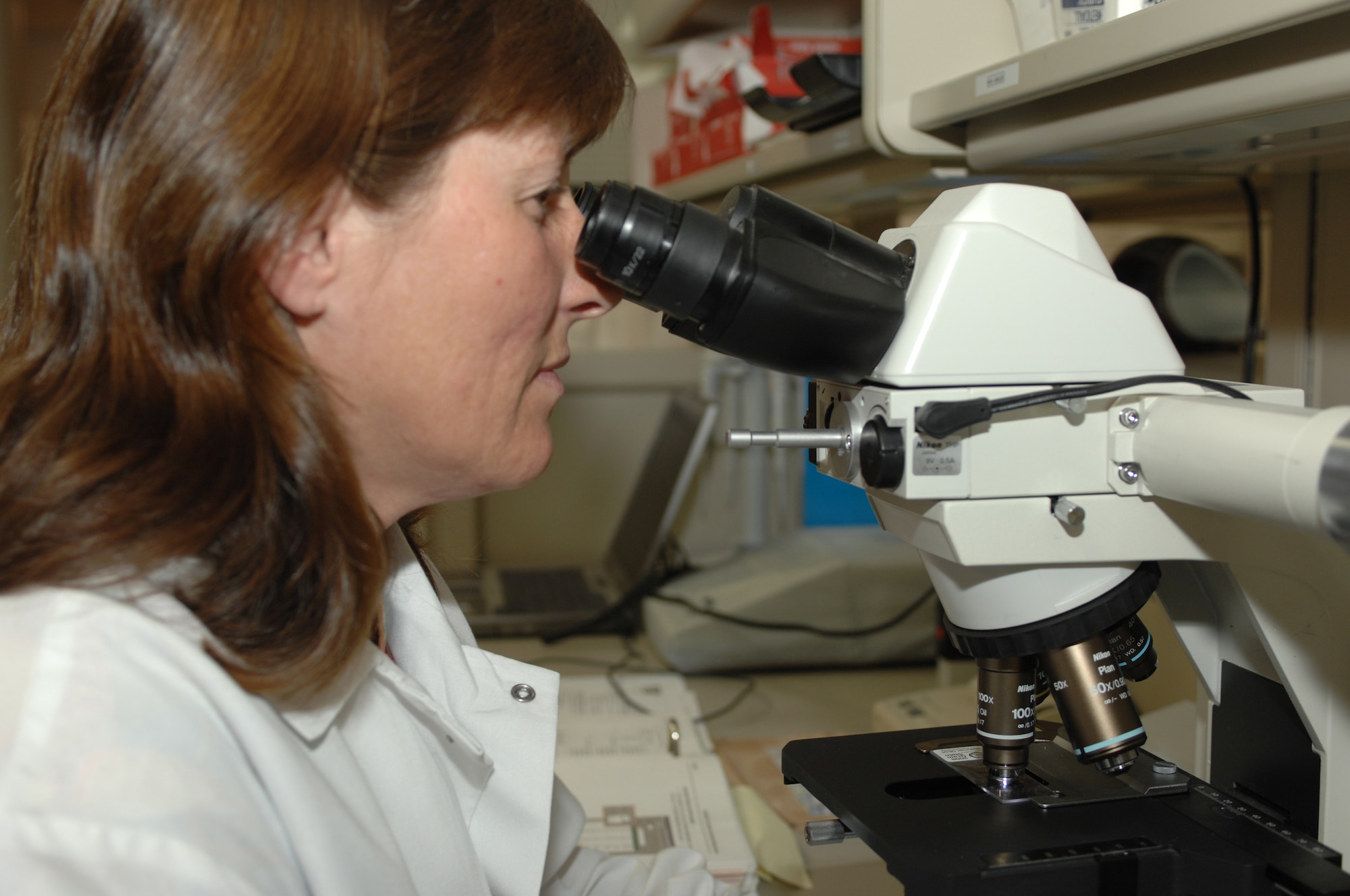 DYESS AIR FORCE BASE, Texas -- Debbi Chance, cilivian lab technician, looks for the difference in white and red blood cells in a sample slide at the 7th Medical Group, March 10, 2008. Lab technicians also check the platelet count level to make sure they are not low. (U.S. Air Force photo by SrA Courtney Richardson)