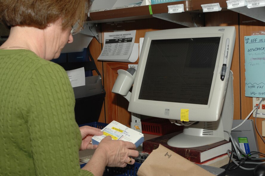 DYESS AIR FORCE BASE, Texas -- Kathy Laurence,civilian pharmacist, verifies a prescription in the database at the pharmacy March 10. Precriptions must be checked in the database to ensure accuracy and distribution. (U.S. Air Force photo by Senior Airman Courtney Richardson)