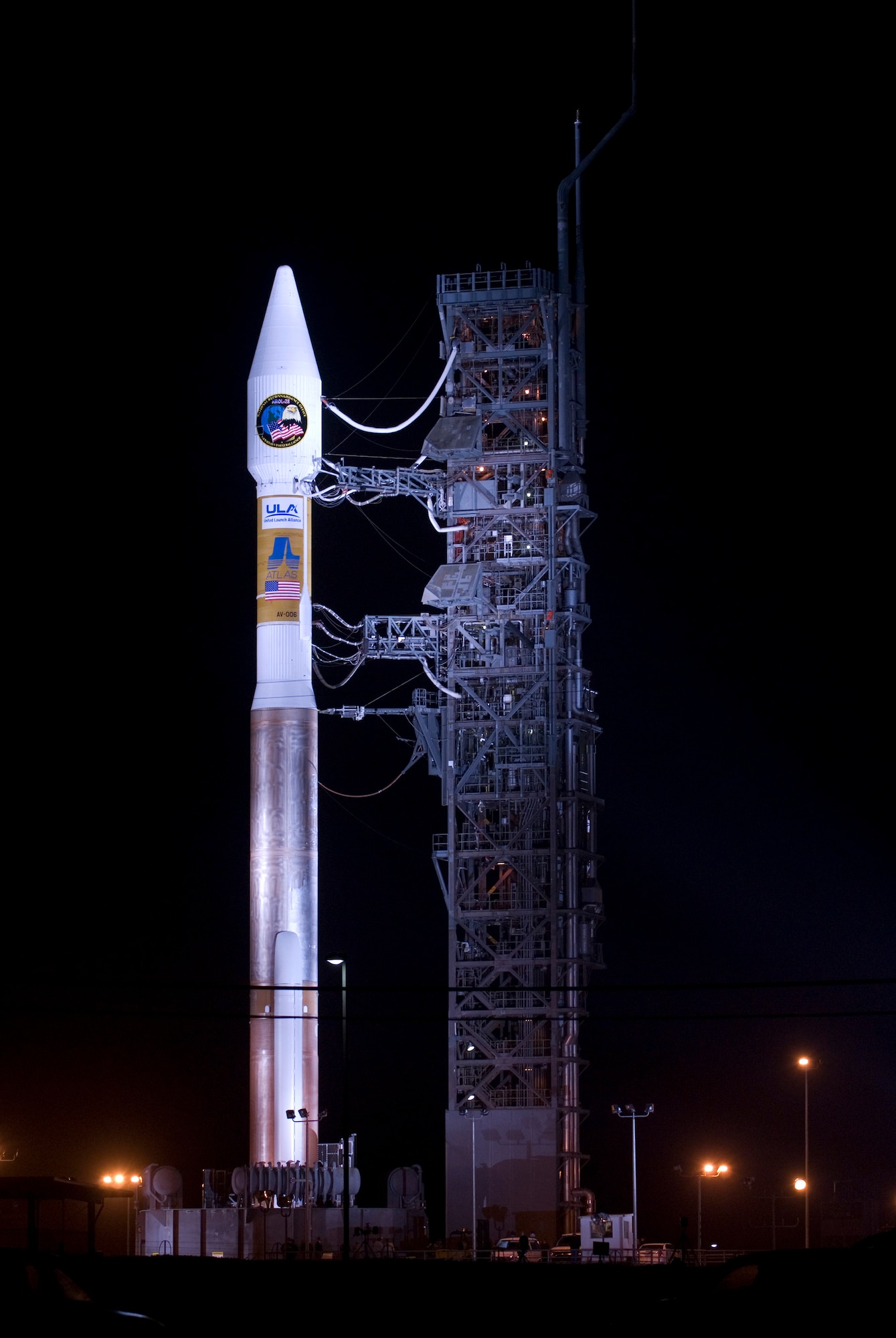 VANDENBERG AIR FORCE BASE, Calif. -- An Atlas V stands on Space Launch Complex-3 during its mobile servicing tower rollback on March 12. Col. Steve Tanous, 30th Space Wing commander, will be the space lift commander for this mission. This will be the first Atlas V launched from Vandenberg and the west coast, as well as the first launch of the year. This milestone for Team Vandenberg is the product of the combined efforts of the 30th Space Wing, the National Reconnaissance Office, United Launch Alliance, the Space and Missile Systems Center, the Aerospace Corporation and more. SLC 3 was significantly modified to get ready for the next generation of space launch vehicles. The Atlas V will be its first launch since the modifications were completed. Previously used for 21 Atlas II launches, the pad received significant upgrades to accommodate the larger and more powerful booster. The tower was made taller, the overhang was extended with a much bigger crane, and the entire pad deck was reconfigured. The pad also features a brand new fixed launch platform. (U.S. Air Force photo/Airman 1st Class Andrew Satran)
