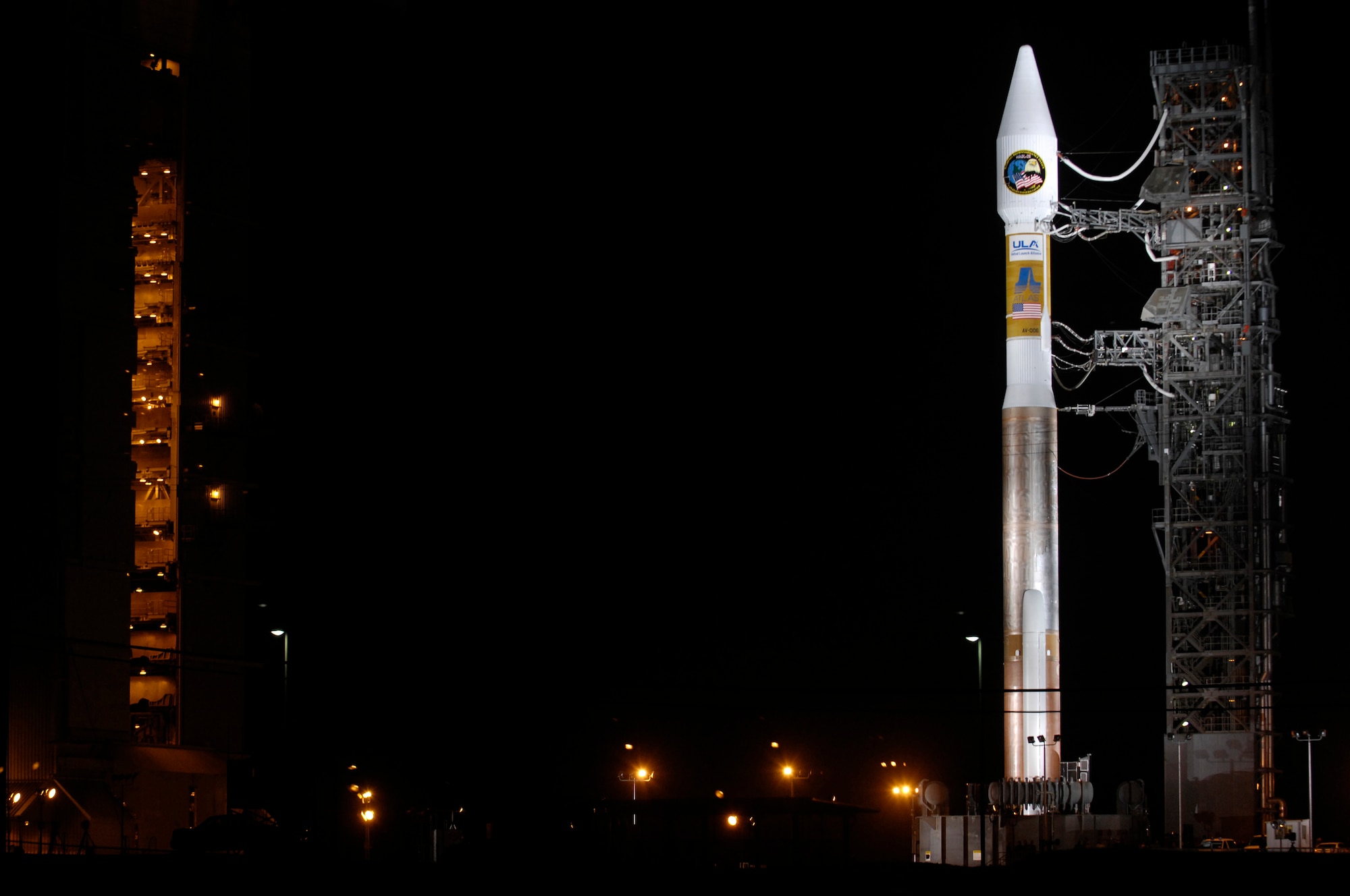 VANDENBERG AIR FORCE BASE, Calif. -- An Atlas V stands on Space Launch Complex-3 during its mobile servicing tower rollback on March 12. Col. Steve Tanous, 30th Space Wing commander, will be the space lift commander for this mission. This will be the first Atlas V launched from Vandenberg and the west coast, as well as the first launch of the year. This milestone for Team Vandenberg is the product of the combined efforts of the 30th Space Wing, the National Reconnaissance Office, United Launch Alliance, the Space and Missile Systems Center, the Aerospace Corporation and more. SLC 3 was significantly modified to get ready for the next generation of space launch vehicles. The Atlas V will be its first launch since the modifications were completed. Previously used for 21 Atlas II launches, the pad received significant upgrades to accommodate the larger and more powerful booster. The tower was made taller, the overhang was extended with a much bigger crane, and the entire pad deck was reconfigured. The pad also features a brand new fixed launch platform. (U.S. Air Force photo/Airman 1st Class Christian Thomas) 



