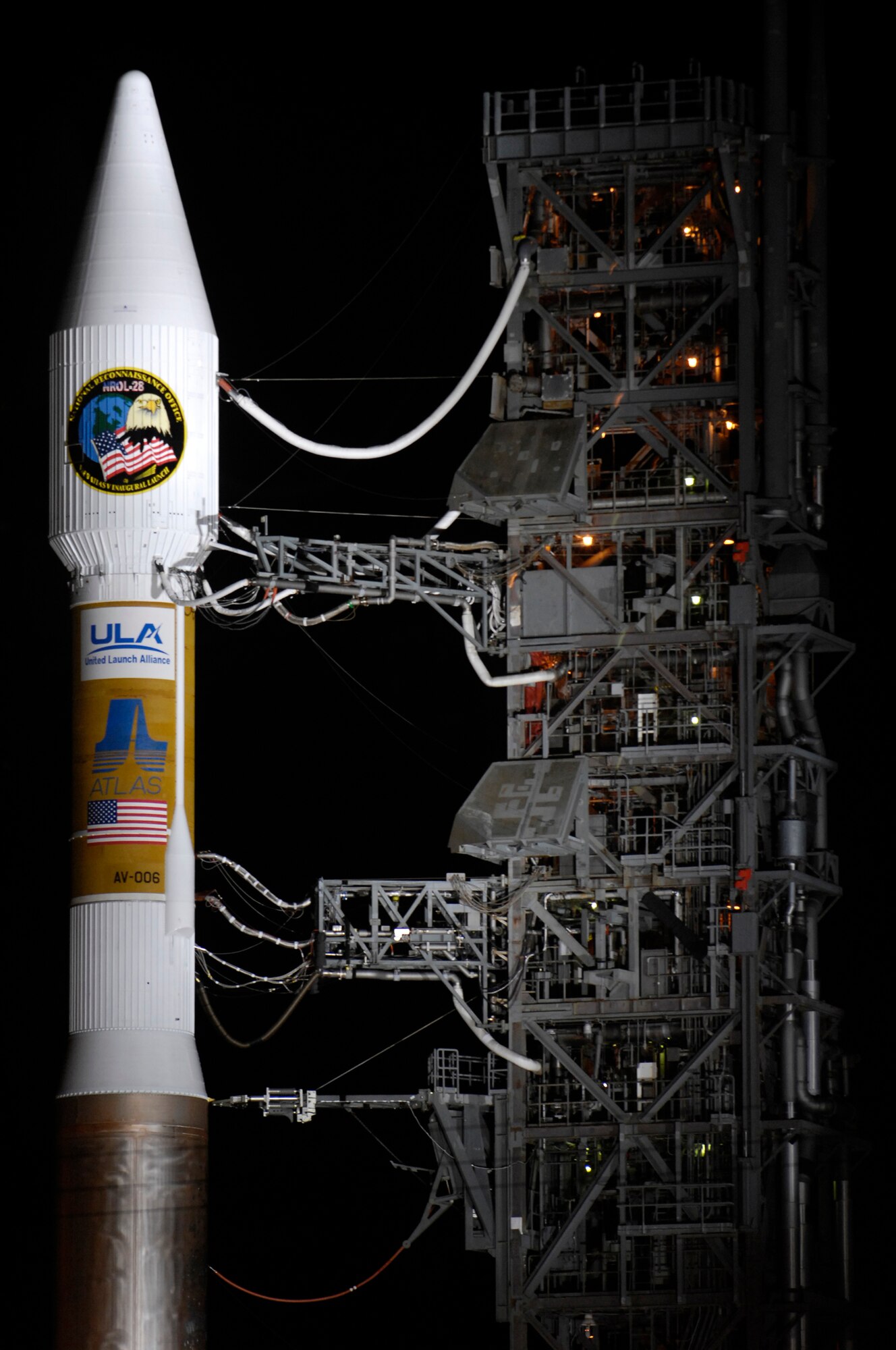 VANDENBERG AIR FORCE BASE, Calif. -- An Atlas V stands on Space Launch Complex-3 during its mobile servicing tower rollback on March 12. Col. Steve Tanous, 30th Space Wing commander, will be the space lift commander for this mission. This will be the first Atlas V launched from Vandenberg and the west coast, as well as the first launch of the year. This milestone for Team Vandenberg is the product of the combined efforts of the 30th Space Wing, the National Reconnaissance Office, United Launch Alliance, the Space and Missile Systems Center, the Aerospace Corporation and more. SLC 3 was significantly modified to get ready for the next generation of space launch vehicles. The Atlas V will be its first launch since the modifications were completed. Previously used for 21 Atlas II launches, the pad received significant upgrades to accommodate the larger and more powerful booster. The tower was made taller, the overhang was extended with a much bigger crane, and the entire pad deck was reconfigured. The pad also features a brand new fixed launch platform. (U.S. Air Force photo/Airman 1st Class Christian Thomas) 


