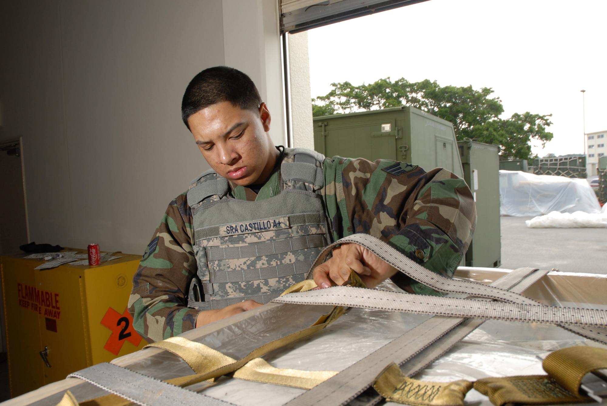 Senior Airman Timothy Castillo, 18th Security Forces Squadron, prepares a pallet for deployment in support of the 2008 Pacific Air Forces Operational Readiness Inspection at Kadena Air Base, Japan, March 13, 2008. PACAF conducted the inspection from March 9 to 15 to validate the mission readiness of the 18th Wing. (U.S. Air Force photo/Tech. Sgt. Jason Edwards)