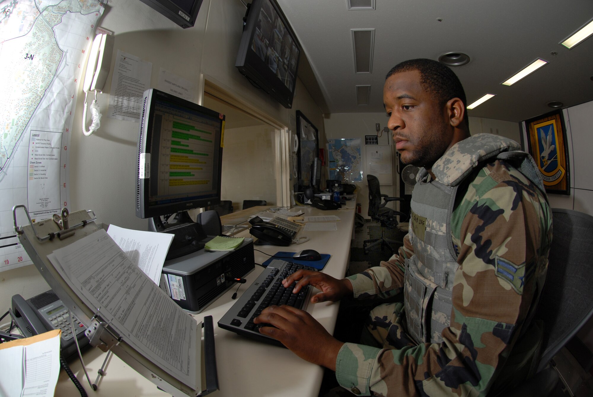 Airman 1st Class Wayne Richard, 18th Security Forces Squadron, inputs real-world blotter entries while participating in the 2008 Pacific Air Forces Operational Readiness Inspection at Kadena Air Base, Japan, March 13, 2008. PACAF conducted the inspection from March 9 to 15 to validate the mission readiness of the 18th Wing. (U.S. Air Force photo/Tech. Sgt. Jason Edwards)