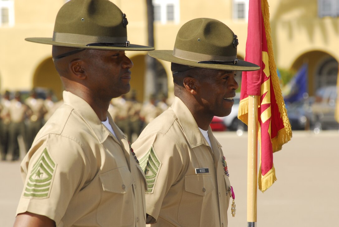 Sgt. Maj. Brian K. Jackson, left, relieves Sgt. Maj. Bobby B. Woods as the sergenat major for the Marine Corps Recruit Depot San Diego and Western Recruiting Region, during a  relief and appointment ceremony on Shepherd Memorial Drill Field March 13. This ceremony was also a retirement ceremony for Woods, who anticipates joining a Junior Reserve Officer Training Corps as an instructor during his retirement.
