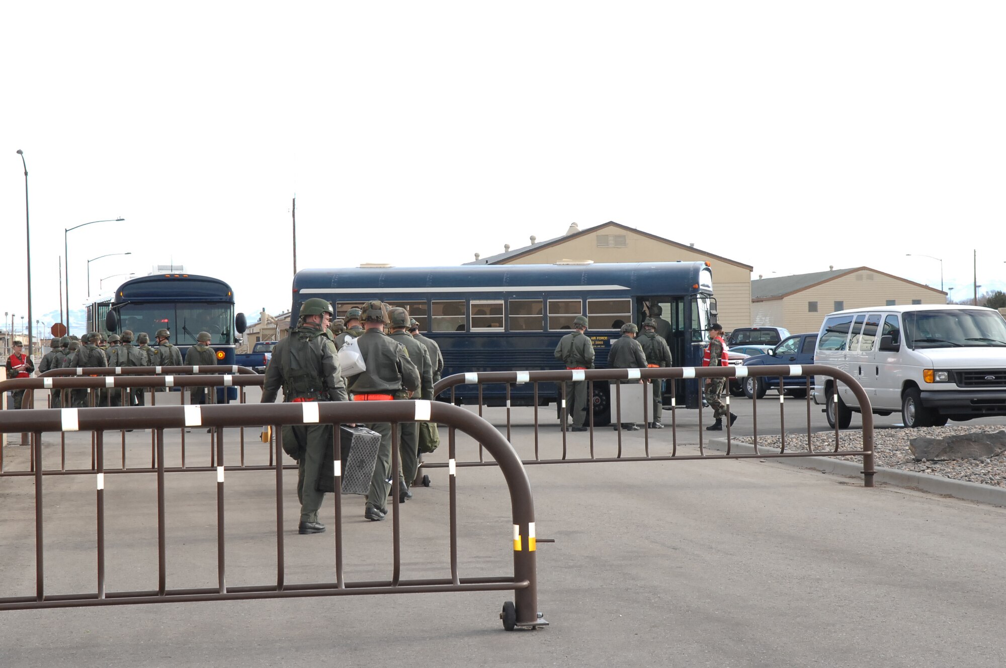 MOUNTAIN HOME AIR FORCE BASE, Idaho -- 366th Fighter Wing military personnel depart the personnel deployment function line after processing to deploy during Exercise Coronet White 08-ACC-14 March 14. The 366th Fighter Wing is participating in an Operational Readiness Inspection March 13-21 to test the wing's ability to deploy and take its mission to war. (U.S. Air Force photo/ Airman 1st Class Ryan Crane)