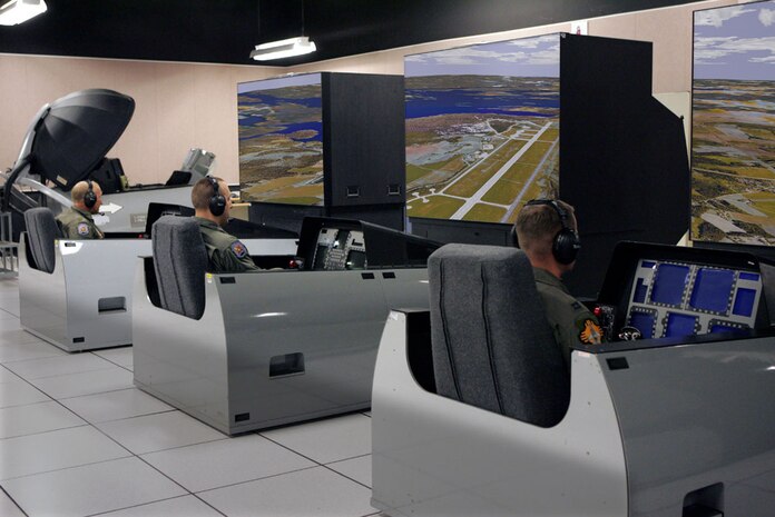 Airmen participating in "Virtual Flag 08-2" fly F-15 C/E simulators at the Distributed Mission Operations Center Kirtland Air Force Base, N. M. ,March, 2008.  The DMOC presented the national 2007 Modeling and Simulation Award.(courtesy photo)