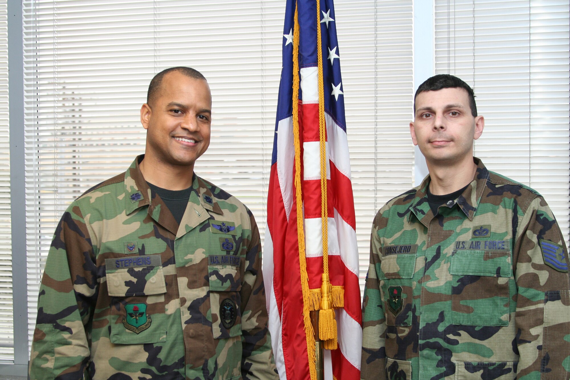 Tech. Sgt. James "JR" Consejero, right, on one of his first days back at work February 2008. The 344th Recruiting Squadron officer accessions recruiter and cancer survivor poses for a photo with his unit commander, Lt. Col. Mike Stephens. (Courtesy photo)
