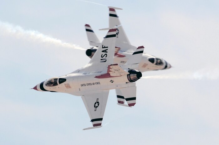 NELLIS AIR FORCE BASE, Nev. -- The U.S. Air Force Thunderbird solo pilots perform the cross over break maneuver during the acceptance show at Nellis Air Force Base, Nev., March 11. The acceptance show marks the beginning of the 2008 show season, which includes 37 showsites in the United States and Canada. (U.S. Air Force photo/Tech. Sgt. Justin D. Pyle)