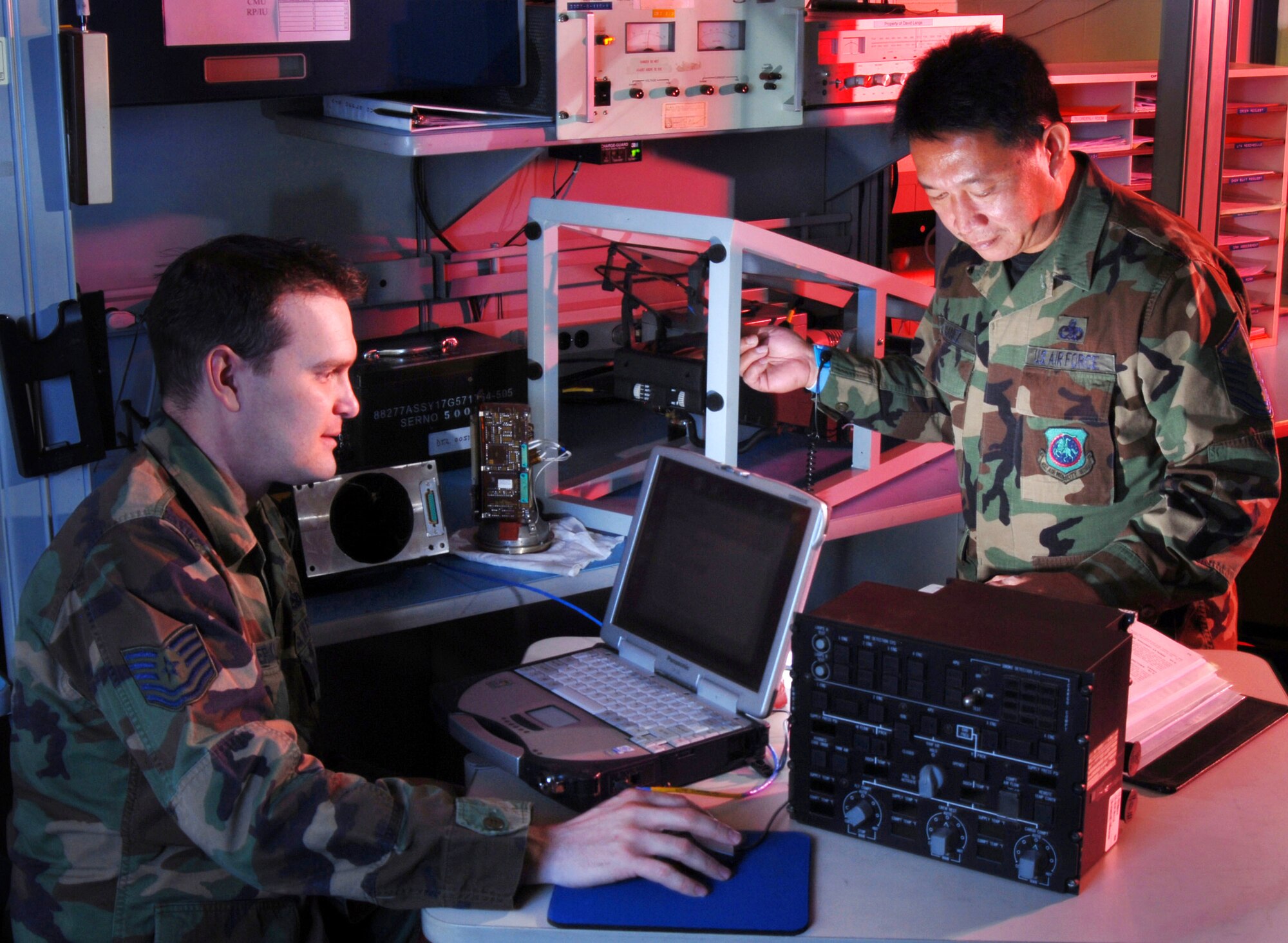 Technical. Sgt. James Erickson (left) and Master Sgt. Onyx Banez check a Head-Up Display (HUD) of a C-17 Globemaster III cargo aircraft at March Air Reserve Base, Calif. Avionics technicians install, maintain and repair electronic and electrical systems on all types of aircraft and they also maintain a high degree of readiness here to deploy worldwide to support wartime and contingency operations and operations other than war in support of national interests and objectives. (U.S. Air Force photo by Val Gempis)