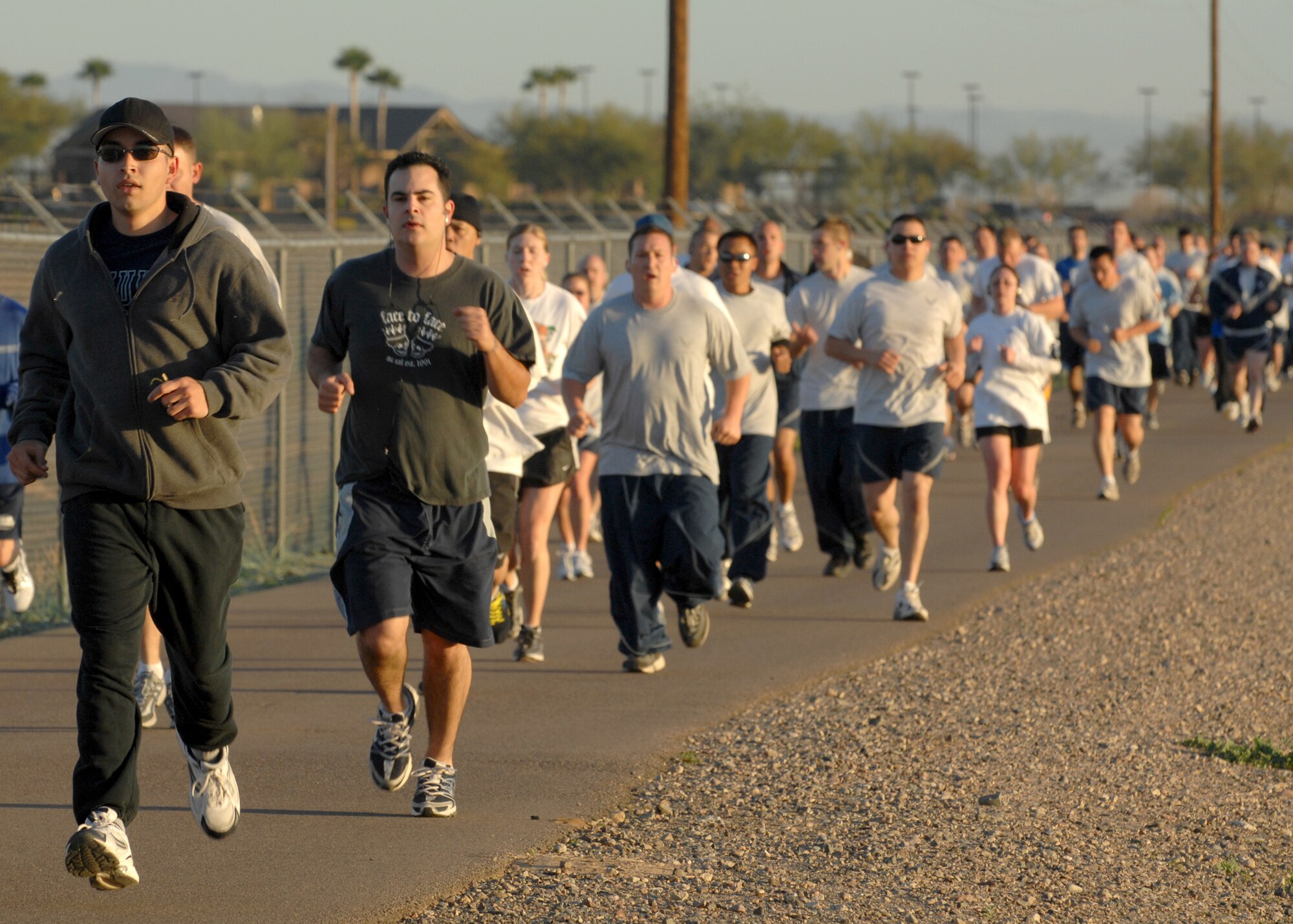 Runners head toward the halfway point during the St. Patrick's Day 5K fun run on Mar. 14. More than 280 runners participated in the early morning run. The 56th Services Squadron sponsors the monthly 5K run at Luke Air Force Base, Ariz. (U.S. Air Force photo/Tech. Sgt. Raheem Moore)
