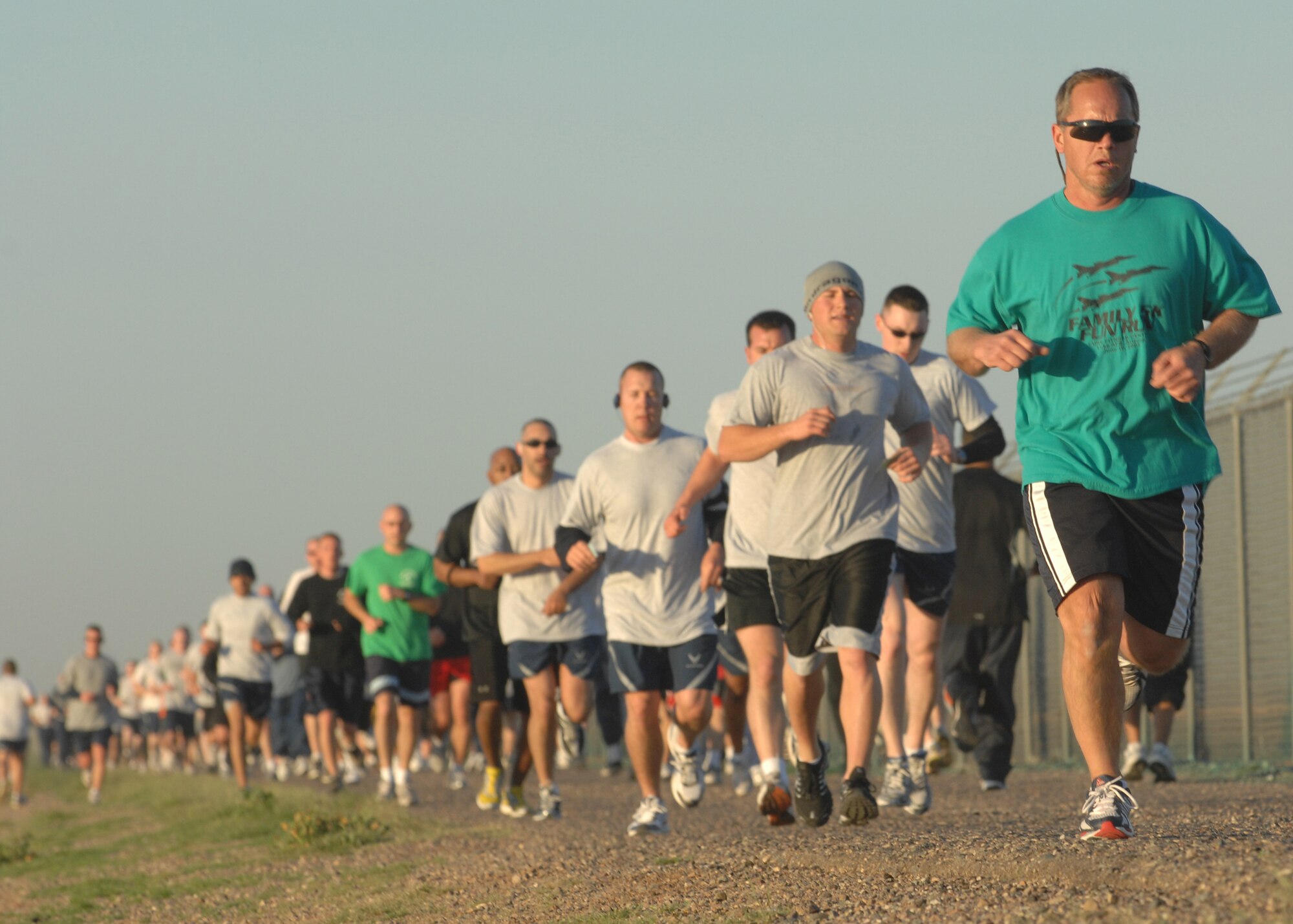 Runners make the push toward the finish line during the St. Patrick's Day 5K fun run on Mar. 14. More than 280 runners participated in the early morning run. The 56th Services Squadron sponsors the monthly 5K run at Luke Air Force Base, Ariz. (U.S. Air Force photo/Tech. Sgt. Raheem Moore)