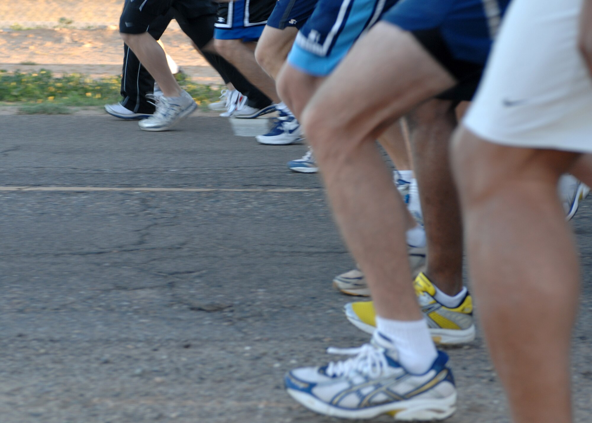 Runners take off from the starting line during the St. Patrick's Day 5K fun run on Mar. 14. More than 280 runners participated in the early morning run. The 56th Services Squadron sponsors the monthly 5K run at Luke Air Force Base, Ariz. (U.S. Air Force photo/Tech. Sgt. Raheem Moore)