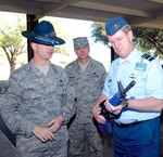 Staff Sgt. Daniel Reed, left, a Military Training Instructor from the 324th Training Recruit Squadron at Lackland Air Force Base, demonstrates to Lt. Gen. Hans de Jong, Royal Netherlands Air Force commander, the blue M-16 rifles basic military trainees carry throughout their training at Lackland. The General toured Randolph and Lackland Air Force Bases as part of an official distinguished visitor tour of headquarters Air Education and Training Command this week. Photo by Rich McFadden
