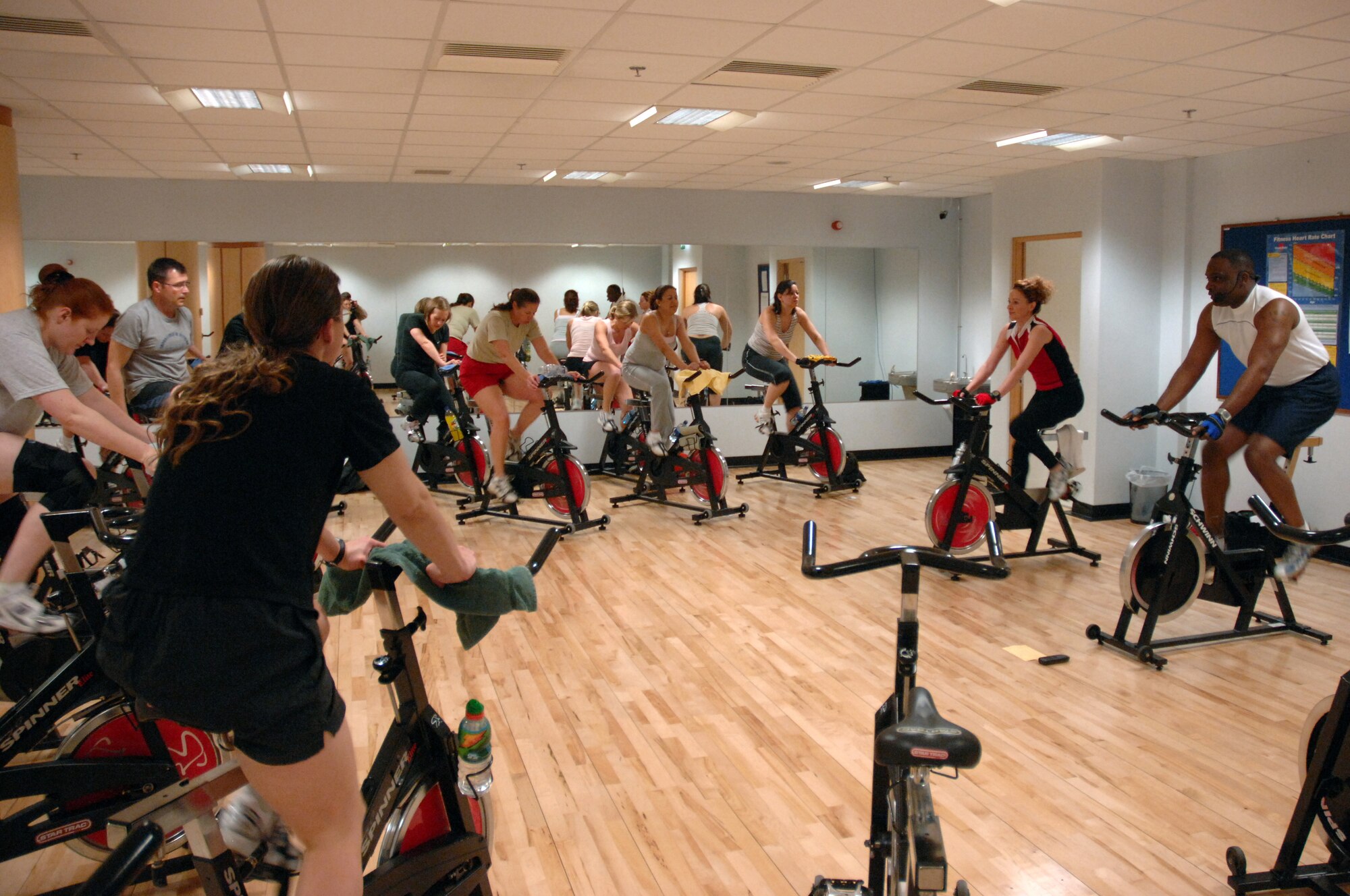 ROYAL AIR FORCE LAKENHEATH, England - Horace Fauntlercy, certified spin instructor, leads a class in one of RAF Lakenheath’s group exercise rooms at the fitness center Mar. 13. Spin class is held Mondays and Wednesdays at 6:15 to 6:45 a.m. and 5:30 to 6:15 p.m. and on Tuesdays and Thursdays at 11:30 a.m. to 12:15 p.m. and 5:30 to 6:15 p.m. For more information, contact the fitness center at 226-3607. (U.S. Air Force photo by Airman 1st Class John Easterling)