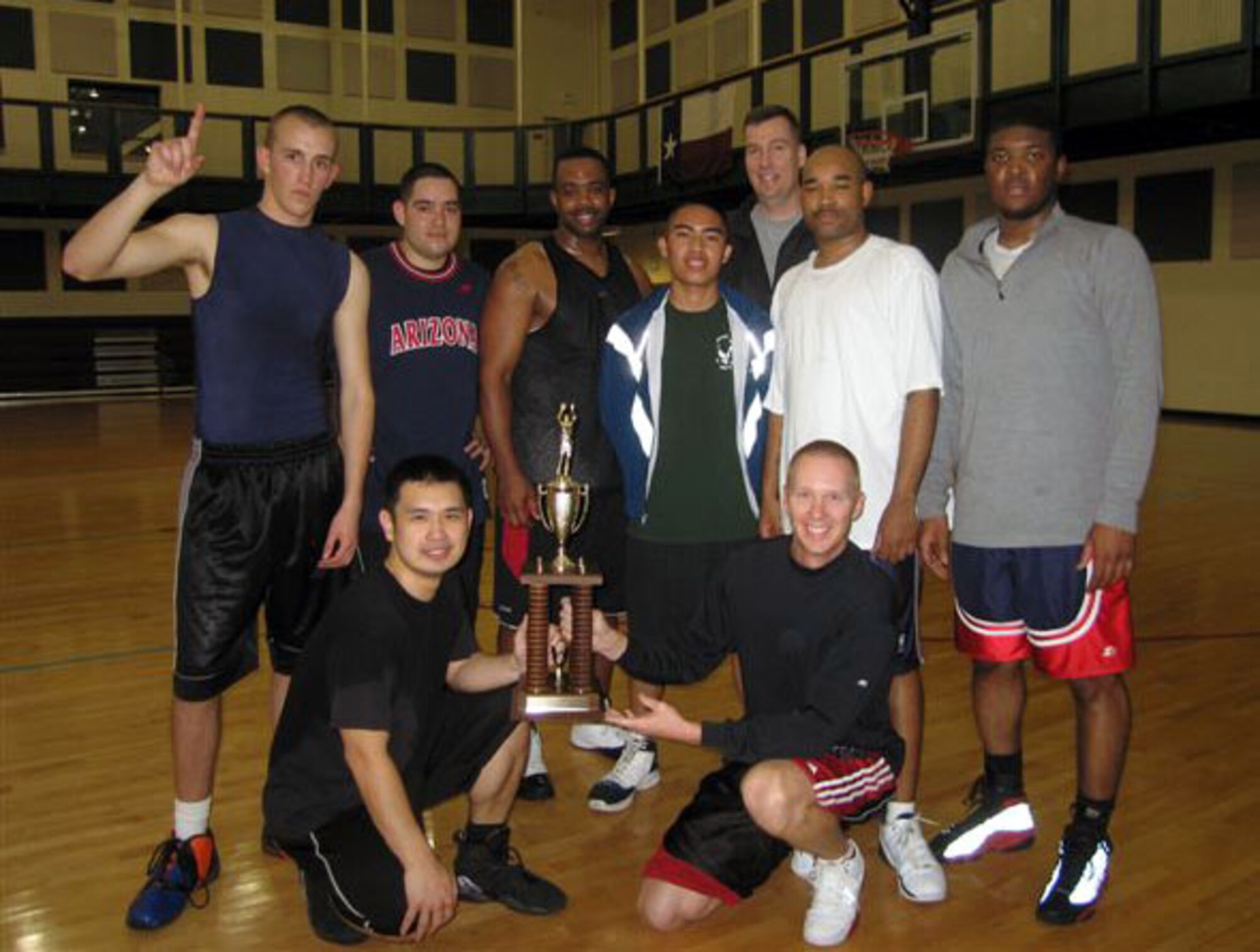 LAUGHLIN AIR FORCE BASE, Texas –The 47th Force Support Squadron shows off their runner-up trophies after the 47th Operations Support Squadron defeated them in the base basketball championship at the Losano Fitness Center March 13. (Contributed photo)