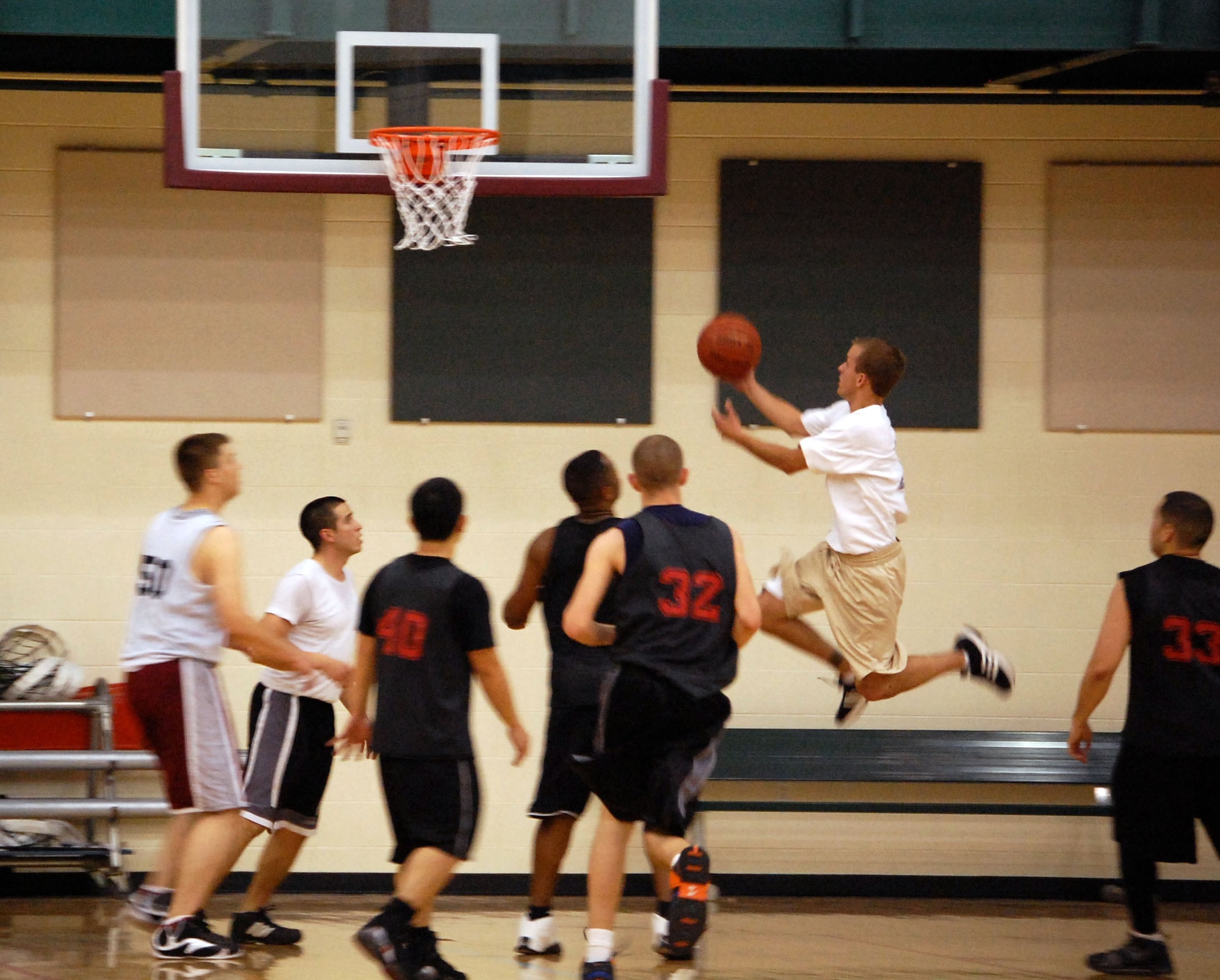 LAUGHLIN AIR FORCE BASE, Texas –Senior Airman Jonathan Miller, 47th Operations Support Squadron, makes an attempt at two points in the second quarter of the base basketball championship at the Losano Fitness Center March 13. (U.S. Air Force photo by Airman 1st Class Sara Csurilla)