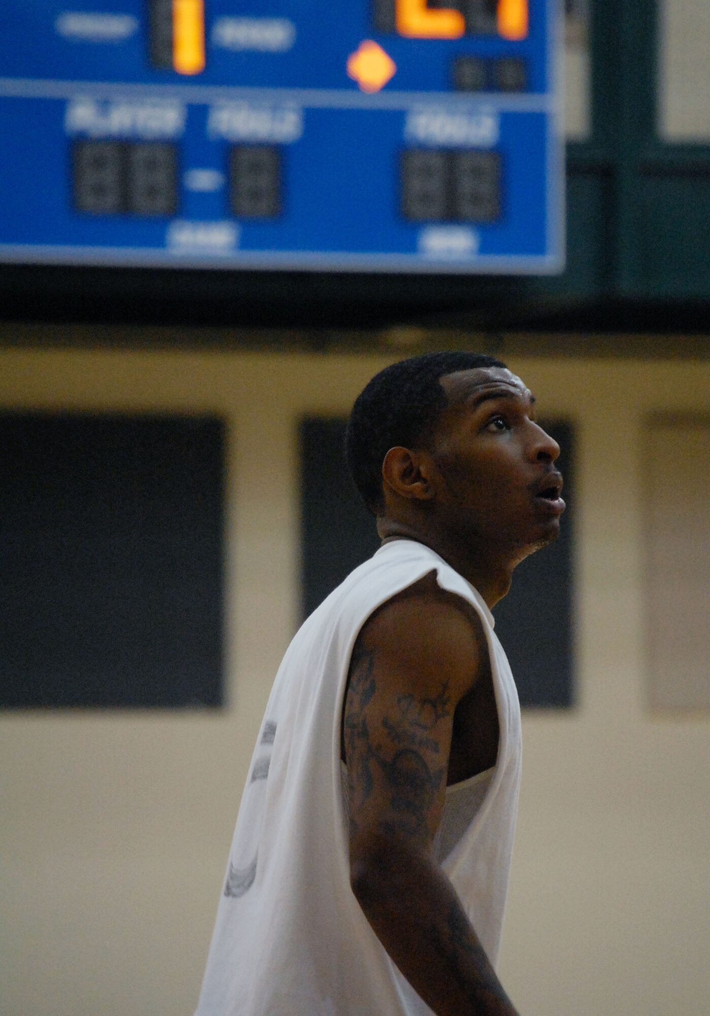 LAUGHLIN AIR FORCE, Texas –Airman 1st Class Jarryd Dooley, 47th Operations Support Squadron, focuses intently on a teammate’s shot attempt, ready to spring into action for a rebound if needed. The 47th OSS defeated the 47th Force Support Squadron in the base basketball championship at the Losano Fitness Center March 13. (U.S. Air Force photo by Airman 1st Class Sara Csurilla)