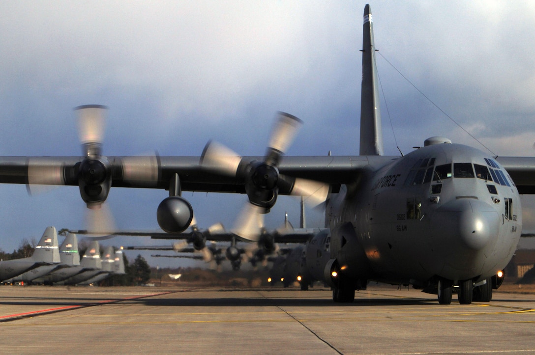 A line of C-130 Hercules aircraft prepare to depart Ramstein Air Base, Germany, March 5 for mass tactical training. The training allows 86th Airlift Wing aircrews to maintain proficiency in large formation flying and airdrop operations. (U.S. Air Force photo/Senior Airman Melissa Sheffield)