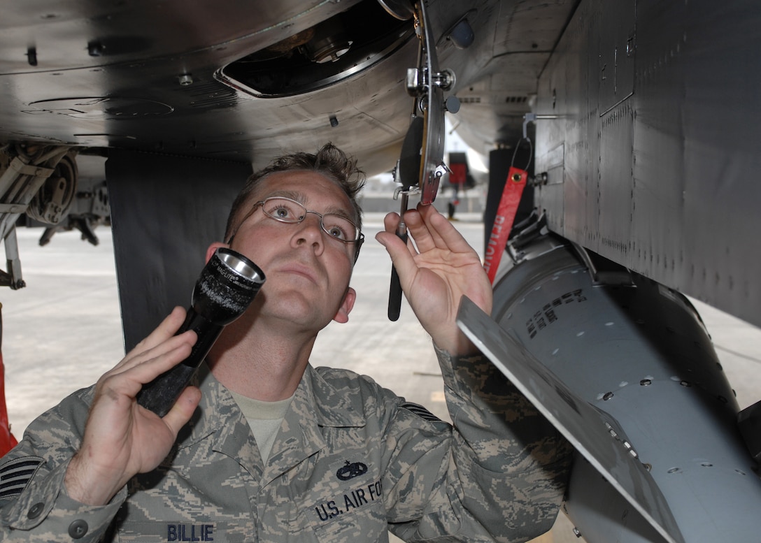 Air Force Staff Sgt. Jonathan Billie inspects the airframe-mounted accessories drive on an F-15E Strike Eagle on March 11, 2008, at Bagram Air Base, Afghanistan. Billie, an F-15E crew chief, is assigned to 335th Expeditionary Aircraft Maintenance Unit and is deployed from Seymour Johnson Air Force Base, N.C. Photo by Master Sgt. Demetrius Lester, USAF