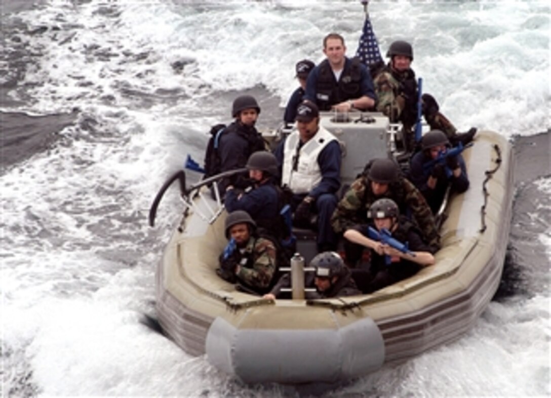 Members of the visit, board, search, and seizure team aboard the guided-missile destroyer USS John S. McCain approach the ship in a rigid hull inflatable boat during a Destroyer Squadron 15 evaluation of their tactics, March 13, 2008. 