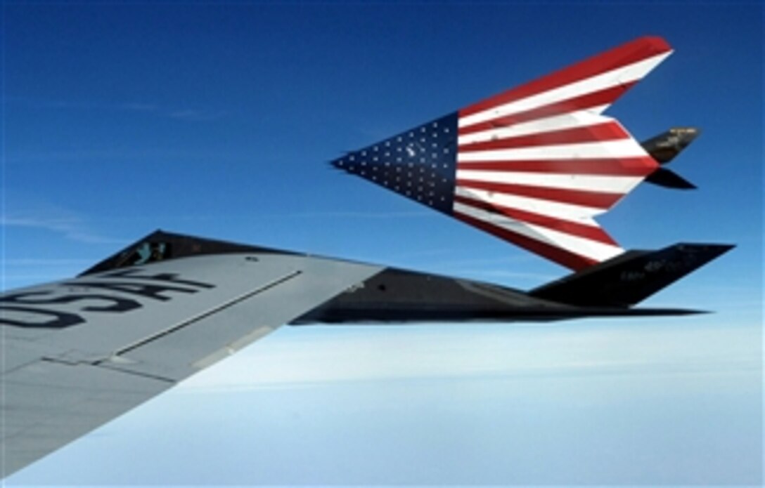 A specially painted F-117 Nighthawk flies off from its last refueling by the Ohio National Guard's 121st Air Refueling Wing. Two F-117s were retired March 1, 2008, in a farewell ceremony at Wright-Patterson Air Force Base, Ohio. 