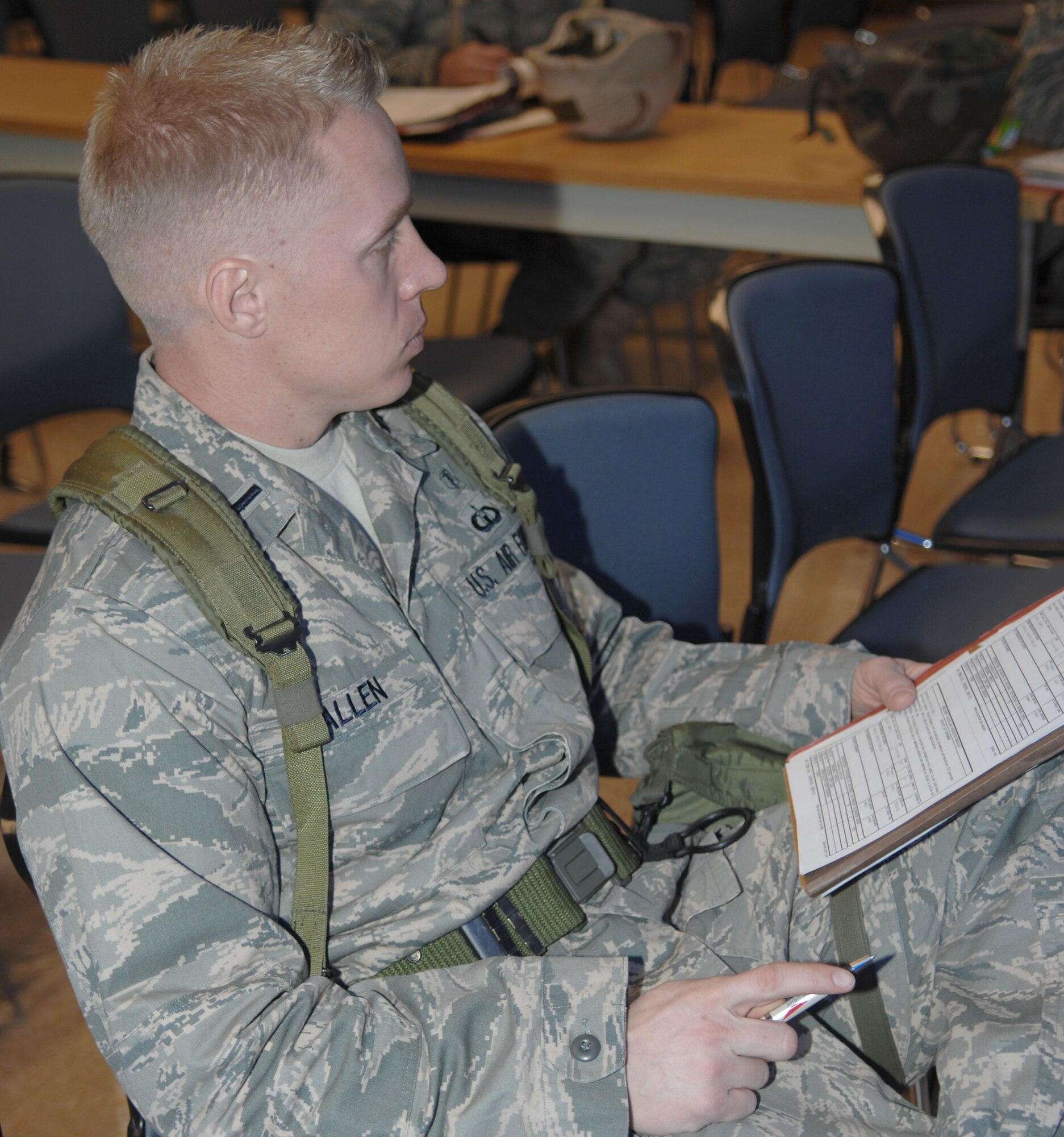 MOUNTAIN HOME AIR FORCE BASE, Idaho -- First Lt. Shawn Allen, 366th Medical Operations Squadron physicians assistant, reviews his documents before processing through the personnel deployment function line during Exercise Coronet White 08-ACC-14 March 14. The 366th Fighter Wing is participating in an Operational Readiness Inspection March 13-21 to test the wing's ability to deploy and take its mission to war. (U.S. Air Force photo by Tech. Sgt. Carly S. Burke)