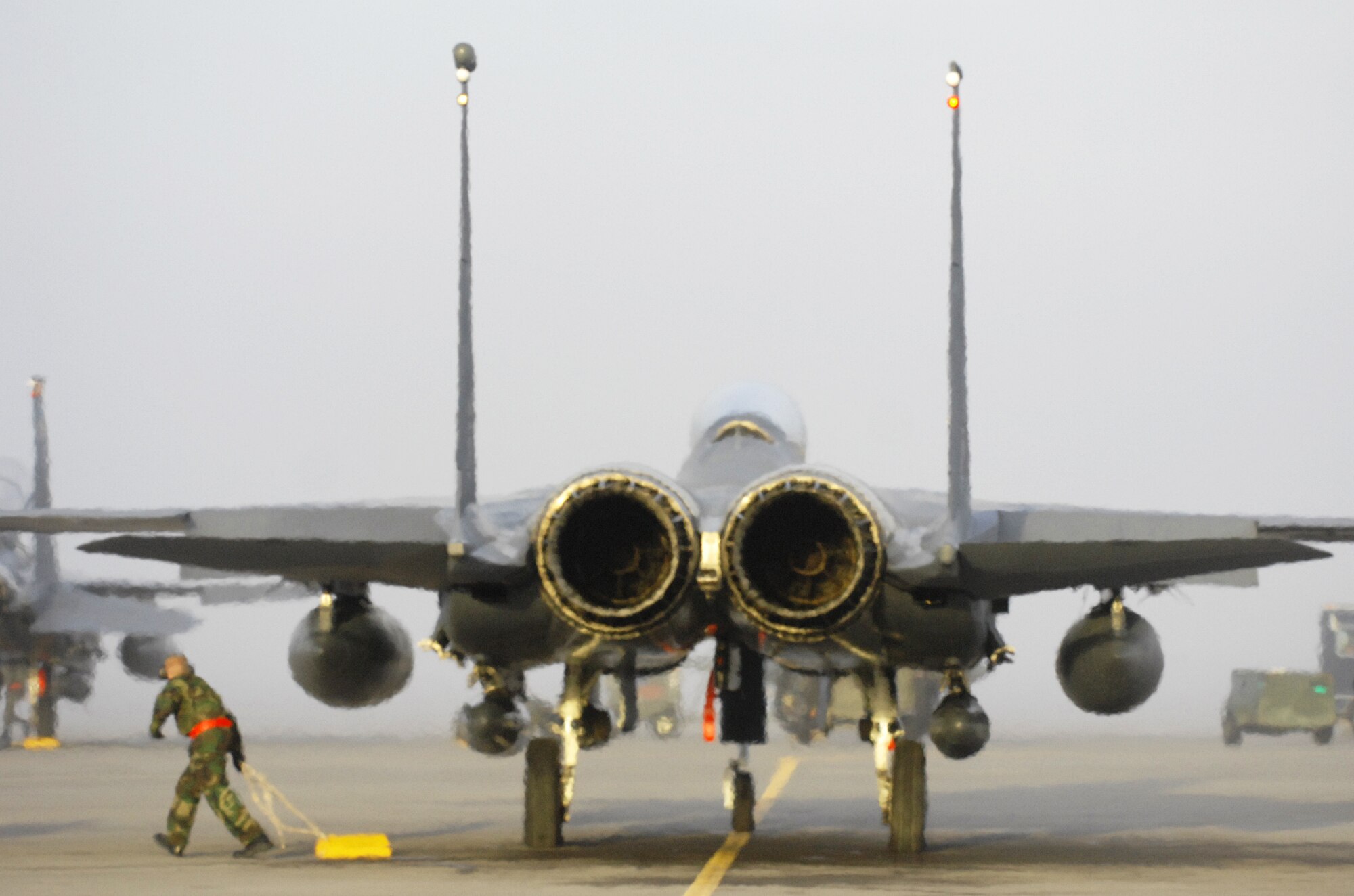MOUNTAIN HOME AIR FORCE BASE, Idaho – Airman 1st Class Devon Park, 389th Aircraft Maintenance Unit crew chief, removes chocks from an F-15E Strike Eagle before it launches during Exercise Coronet White 08-ACC-14 March 15. During this exercise, the 366th Maintenance Group is required to generate a predetermined number of jets and successfully deploy them downrange. The 366th Fighter Wing is participating in an Operational Readiness Inspection March 13-21 to test the wing’s ability to deploy and take its mission to war. (U.S. Air Force photo/ Airman 1st Class Ryan Crane)