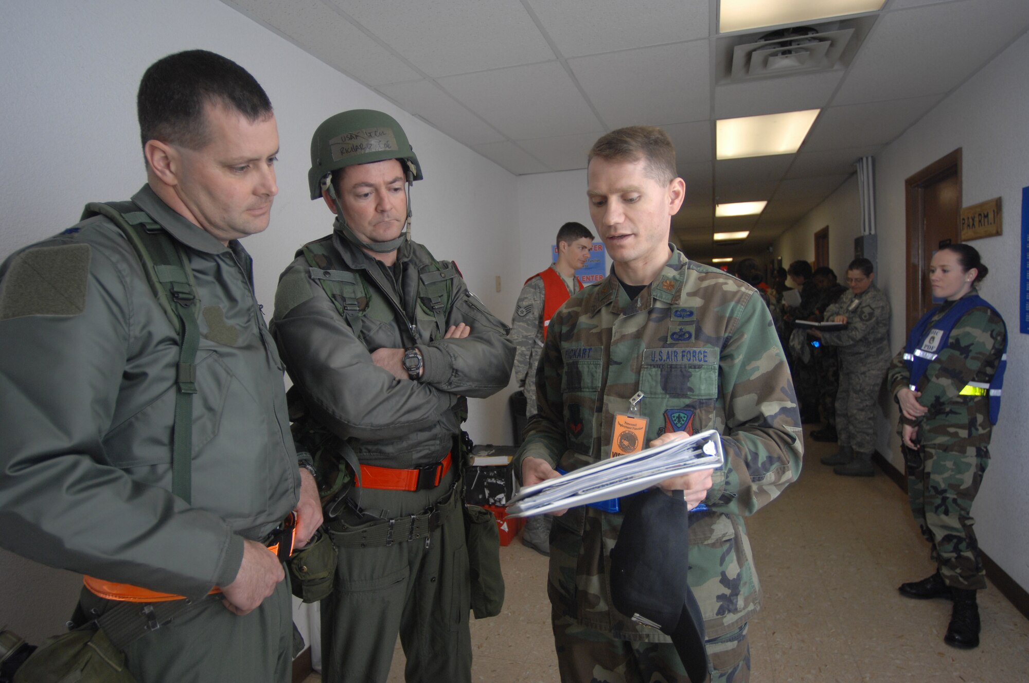 MOUNTAIN HOME AIR FORCE BASE, Idaho - Maj. Damien Pickart, 366th Fighter Wing Public Affairs chief, provides media training to Lt. Col. Daniel Orcutt, 391st Fighter Squadron commander, and Lt. Col. Richard Coe, 389th FS commander, prior to conducting an interview with an exercise media representative during Exercise Coronet White 08-ACC-14 March 14. The 366th Fighter Wing is participating in an Operational Readiness Inspection March 13-21 to test the wing's ability to deploy and take its mission to war. (U.S. Air Force photo/ Airman 1st Class Ryan Crane) 