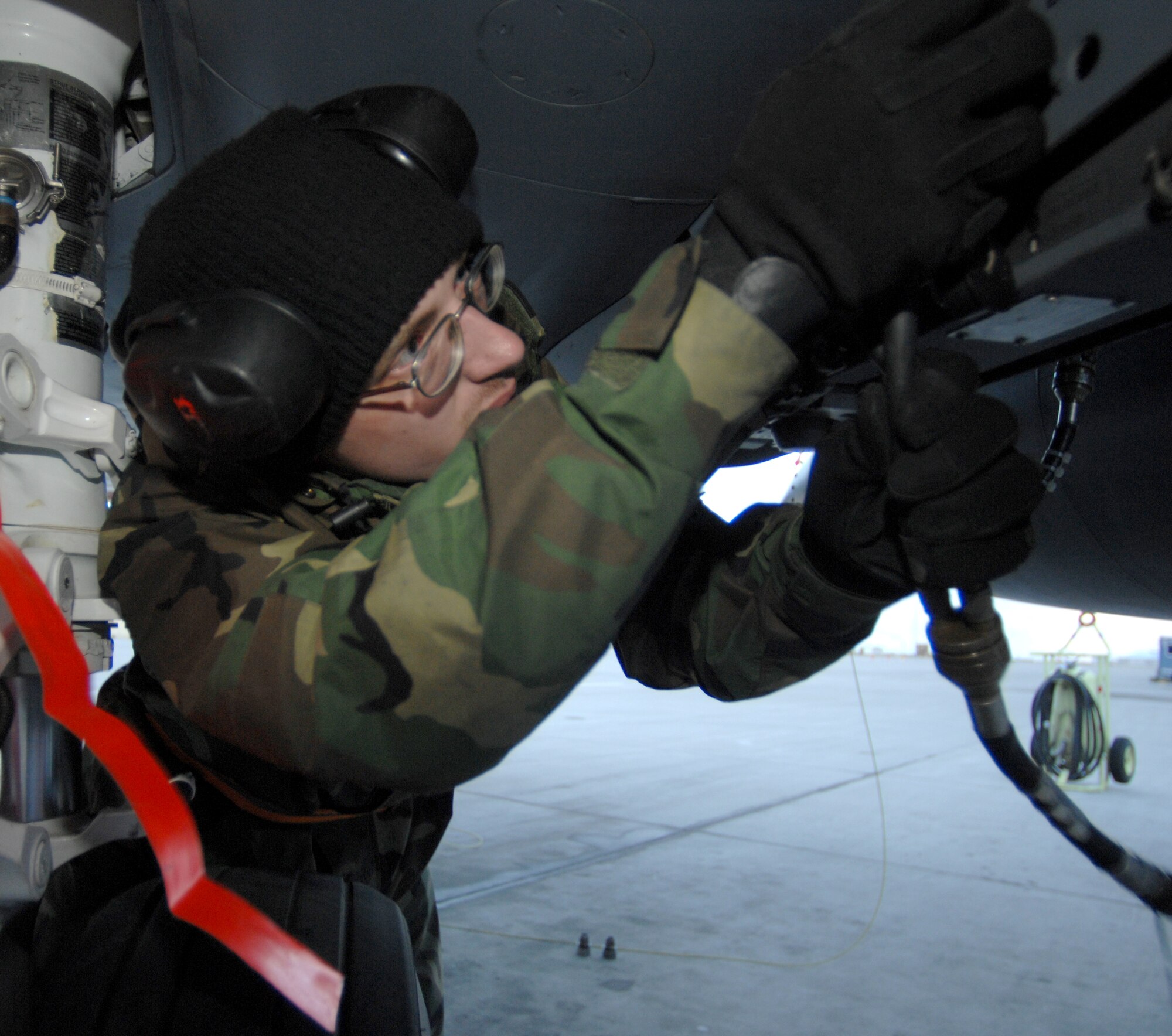 MOUNTAIN HOME AIR FORCE BASE, Idaho - Airman 1st Class Canyn Latham, 389th Aircraft Maintenance Unit weapons technician, connects a 198 test to an F-15E Strike Eagle to insure the bomb racks are functioning correctly during Exercise Coronet White 08-ACC-14 March 14. The 366th Fighter Wing is participating in an Operational Readiness Inspection March 13-21 to test the wing's ability to deploy and take its mission to war. (U.S. Air Force photo/ Airman 1st Class Stephany Miller) 