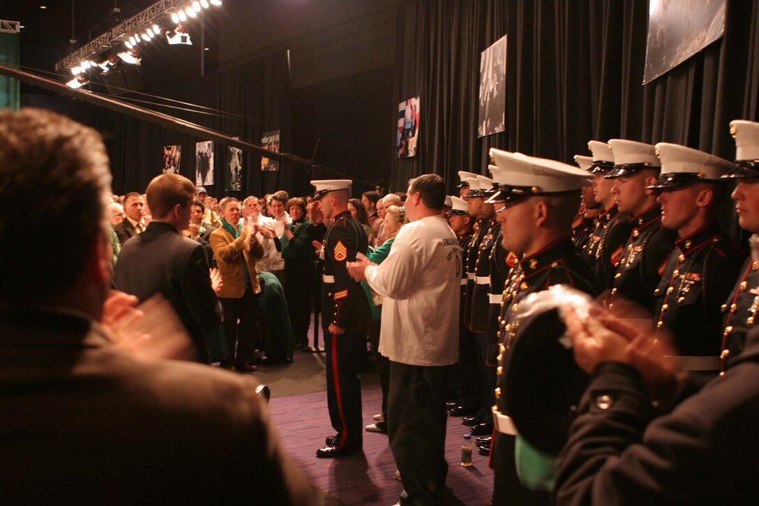 Marines and sailors from 2nd Battalion, 6th Marine Regiment, Company G, receive a standing ovation at the annual South Boston St. Patrick's Day Breakfast, March 16, 2008, in Boston.  The Marines were invited as guests to honor the memory of Lance Cpl. Walter O'Haire, a member of G Co. who was killed in Iraq on March 9, 2007, in Fallujah, Iraq (Official USMC photo by Cpl. Aaron J. Rock)