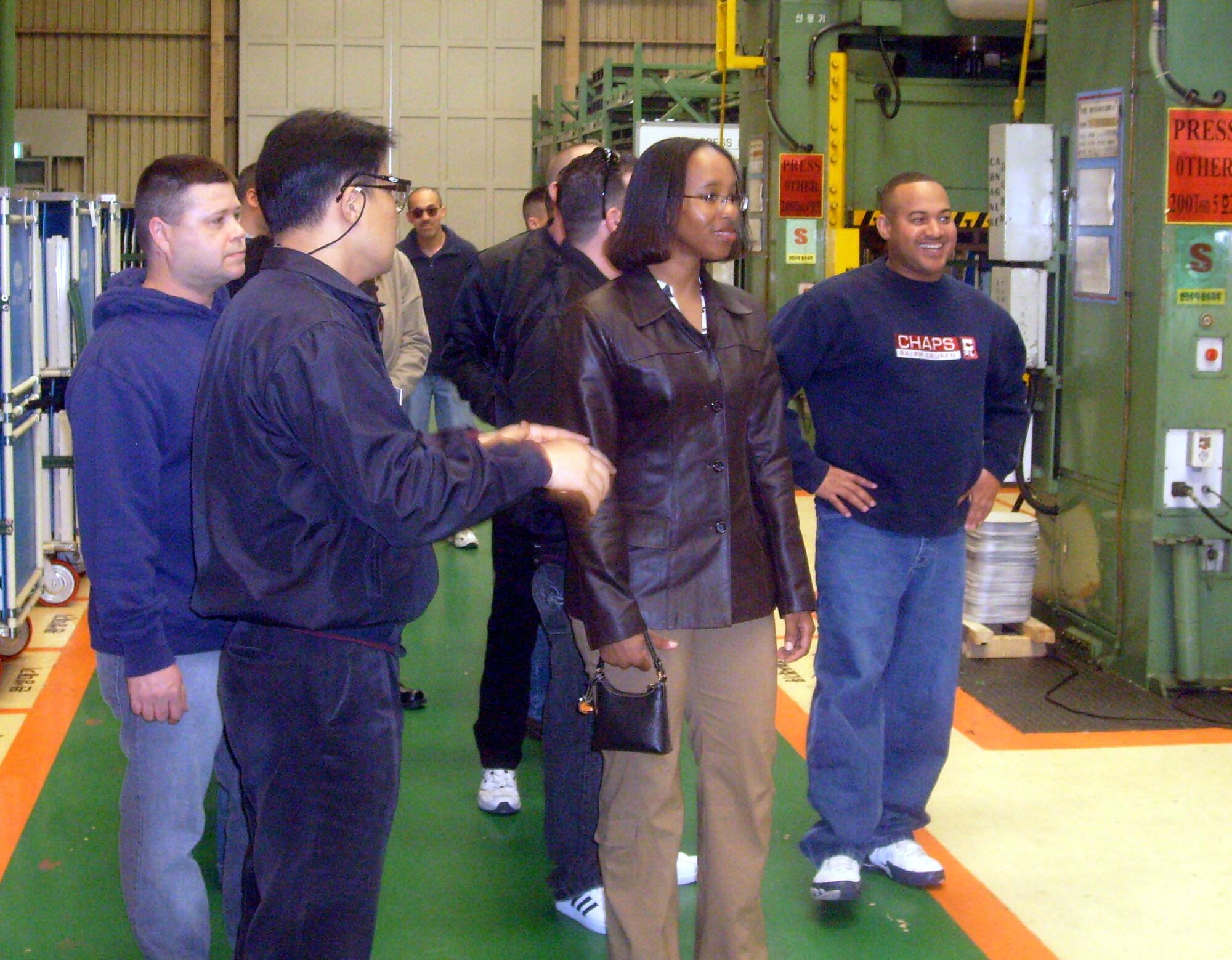 Airmen from the 607th Material Maintenance Squadron, Detachment 1, Gwangju Air Base, Republic of Korea, tour the Carrier Company factory March 14. The tour was part of the Good Neighbor Program, which encompasses a wide array of programs that actively engage the local community, government, media, business, university, school and military in order to provide public understanding and appreciation of the U.S. Forces Korea mission on the peninsula. (U.S. Air Force photo/ Pak, Ki Hyon)