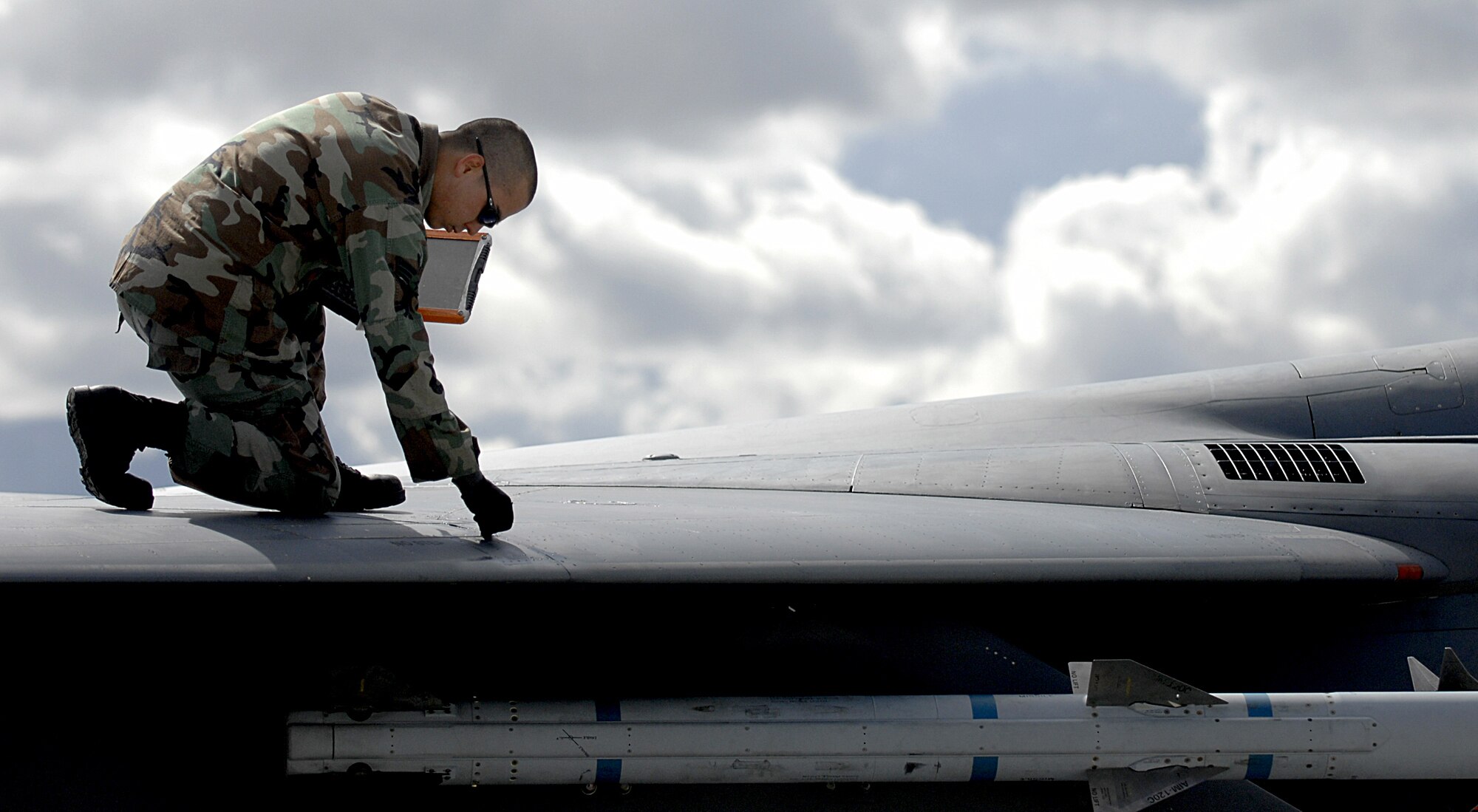 MOUNTAIN HOME AIR FORCE BASE, Idaho – Senior Airman Matthew Cramer, 391st Aircraft Maintenance Unit crew chief, checks an F-15E Strike Eagle for structural damage following the recovery of the aircraft during Exercise Coronet White 08-ACC-14 March 15. During the Phase I portion of the exercise, maintenance crews quickly refuel, and reload weapons onto the jets to prepare them for combat missions in the simulated deployed location. The 366th Fighter Wing is participating in an Operational Readiness Inspection March 13-21 to test the wing’s ability to deploy and take its mission to war. (U.S. Air Force photo/ Airman 1st Class Ryan Crane)