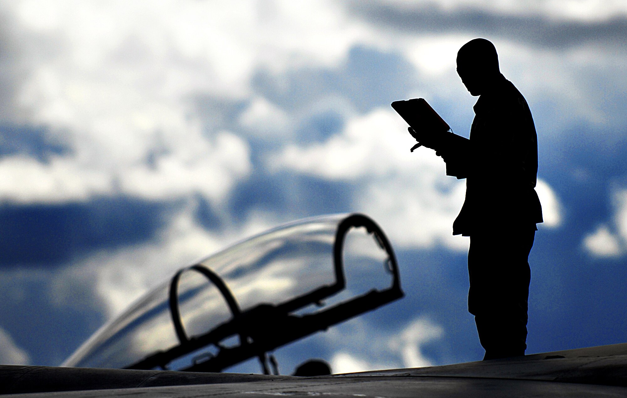 MOUNTAIN HOME AIR FORCE BASE, Idaho – Senior Airman Matthew Cramer, 391st Aircraft Maintenance Unit crew chief, uses his checklist to inspect the required areas of an F-15E Strike Eagle following the recovery of the aircraft during Exercise Coronet White 08-ACC-14 March 15. During the Phase I portion of the exercise, maintenance crews quickly ensure the jets are regenerated to enable them to start flying combat missions in the simulated deployed location. The 366th Fighter Wing is participating in an Operational Readiness Inspection March 13-21 to test the wing’s ability to deploy and take its mission to war. (U.S. Air Force photo/ Airman 1st Class Ryan Crane)