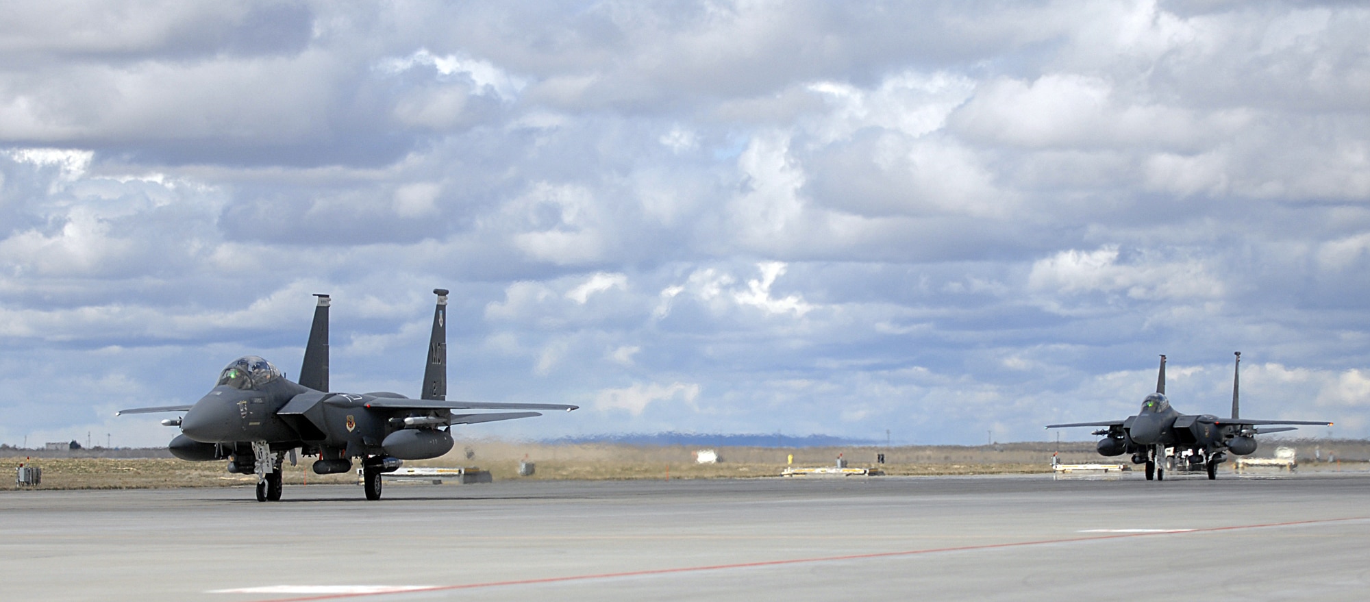 MOUNTAIN HOME AIR FORCE BASE, Idaho – Two F-15E Strike Eagles from the 391st Fighter Squadron taxi down the flightline after landing at the simulated deployed location during Exercise Coronet White 08-ACC-14 March 15. During the Phase I portion of the exercise, the 366th Maintenance Group is required to generate a predetermined number of jets and successfully deploy downrange. The 366th Fighter Wing is participating in an Operational Readiness Inspection March 13-21 to test the wing’s ability to deploy and take its mission to war. (U.S. Air Force photo/ Airman 1st Class Ryan Crane)